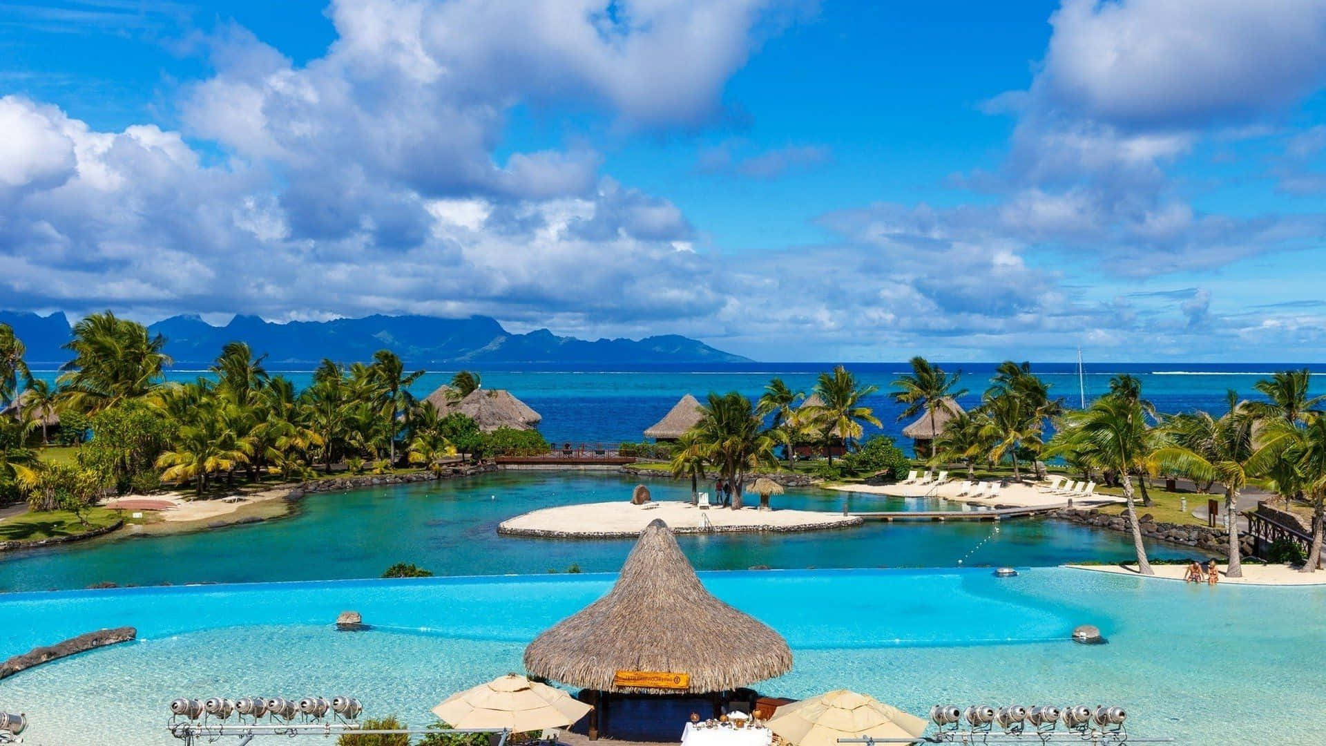 Relaxation at Its Finest: Breathtaking Beach Resort Wallpaper