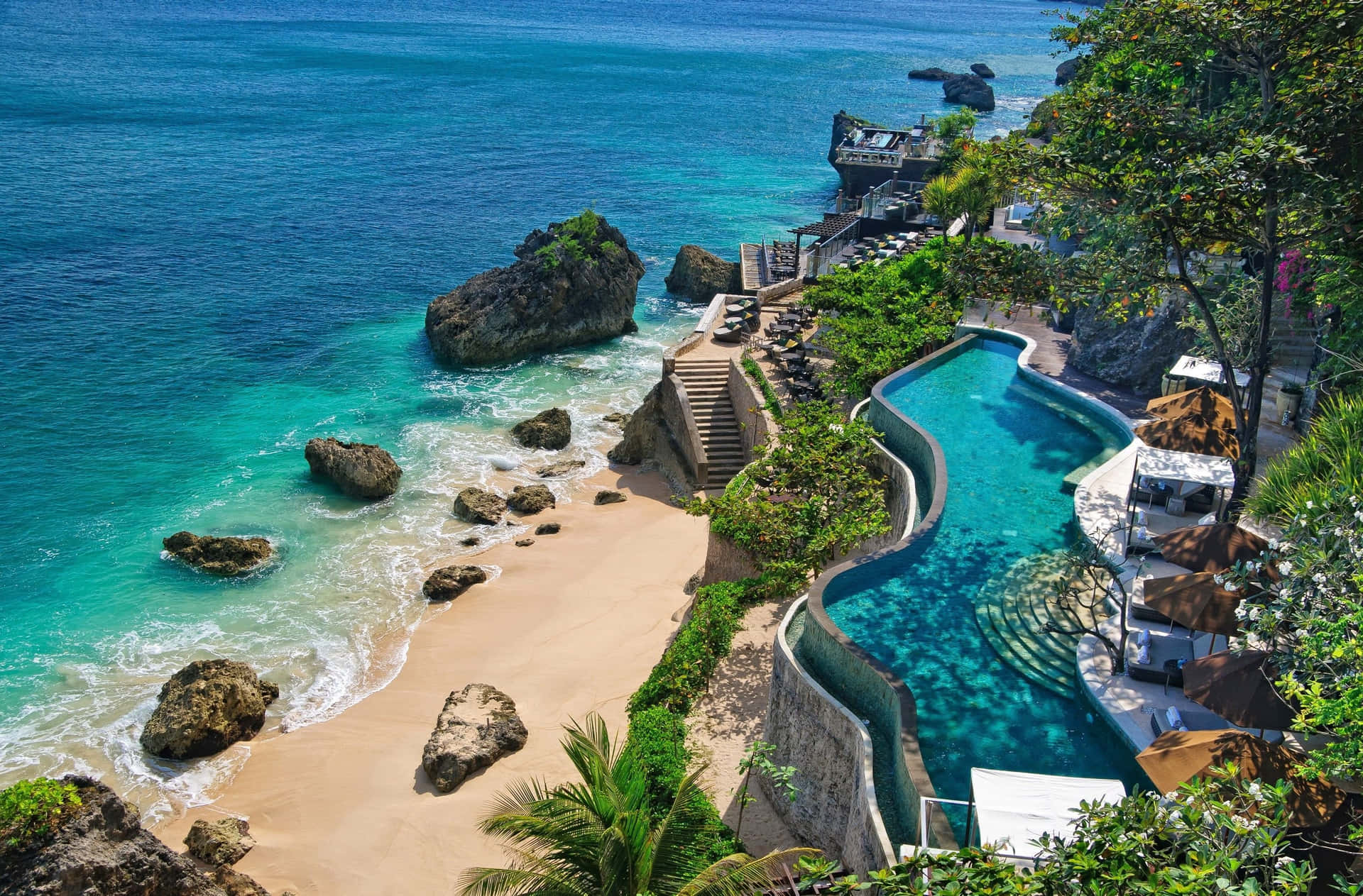 Caption: Stunning Aerial View of a Luxury Beach Resort Wallpaper
