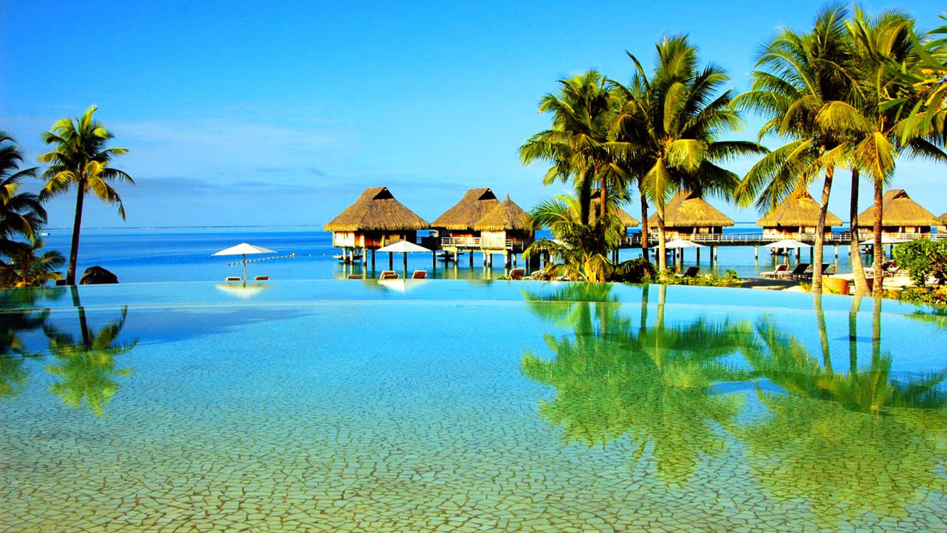 Relaxing Paradise at a Luxurious Beach Resort Wallpaper