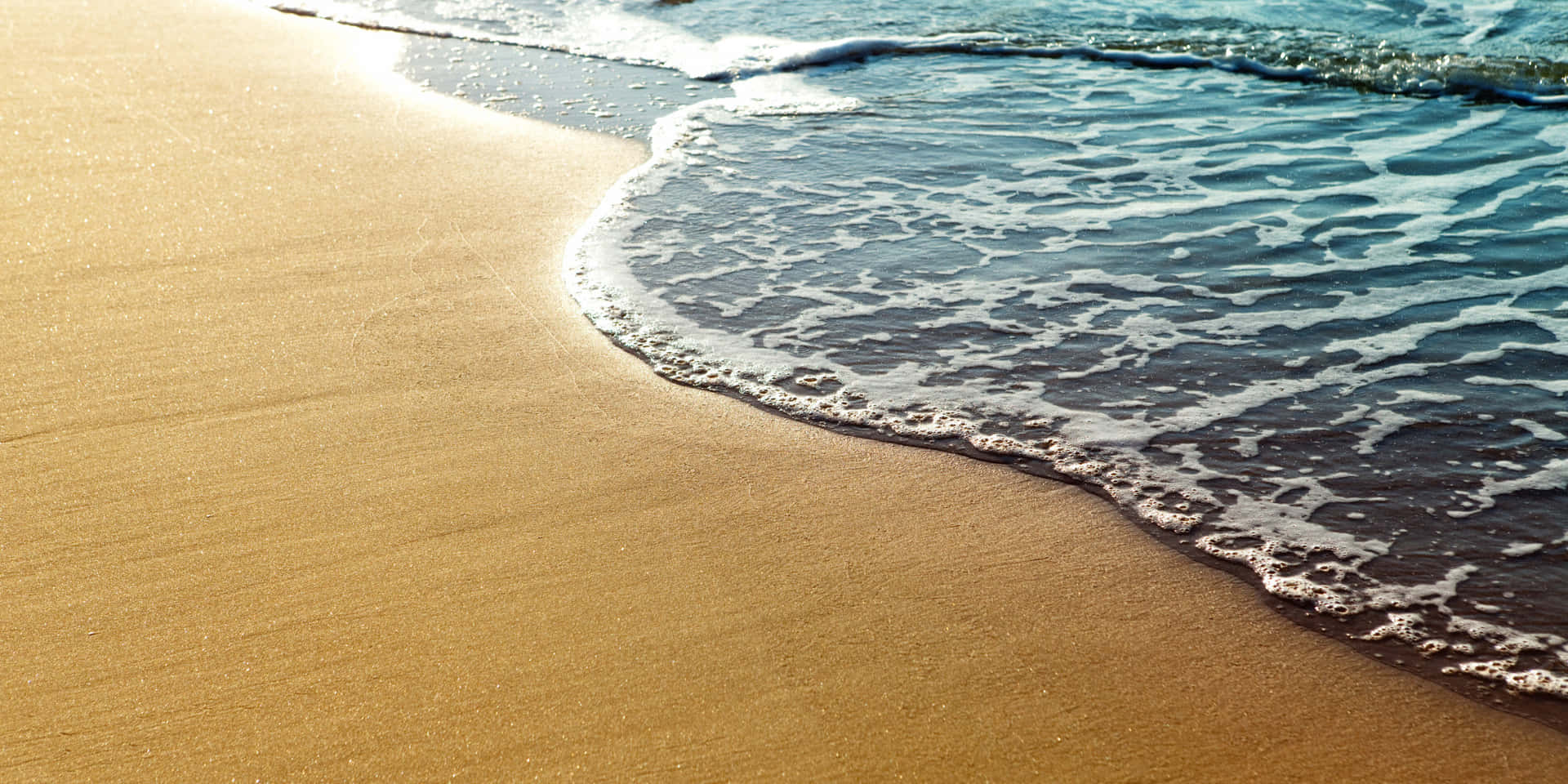 Golden Beach Sand With Wave Patterns Wallpaper