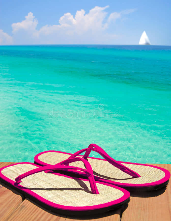 Stylish Beach Sandals on a Sunny Beach Wallpaper