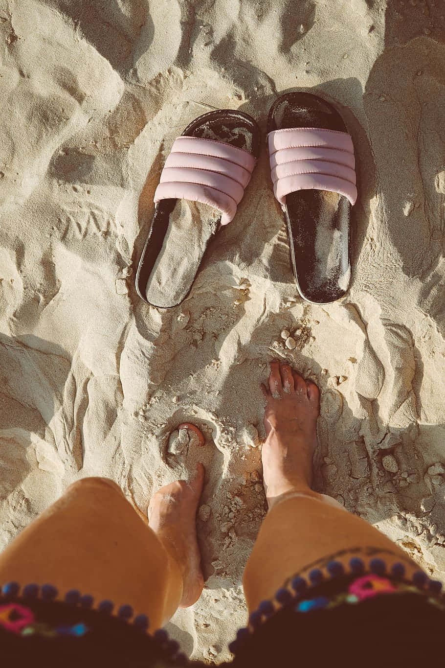 Stylish Beach Sandals on Golden Shore Wallpaper