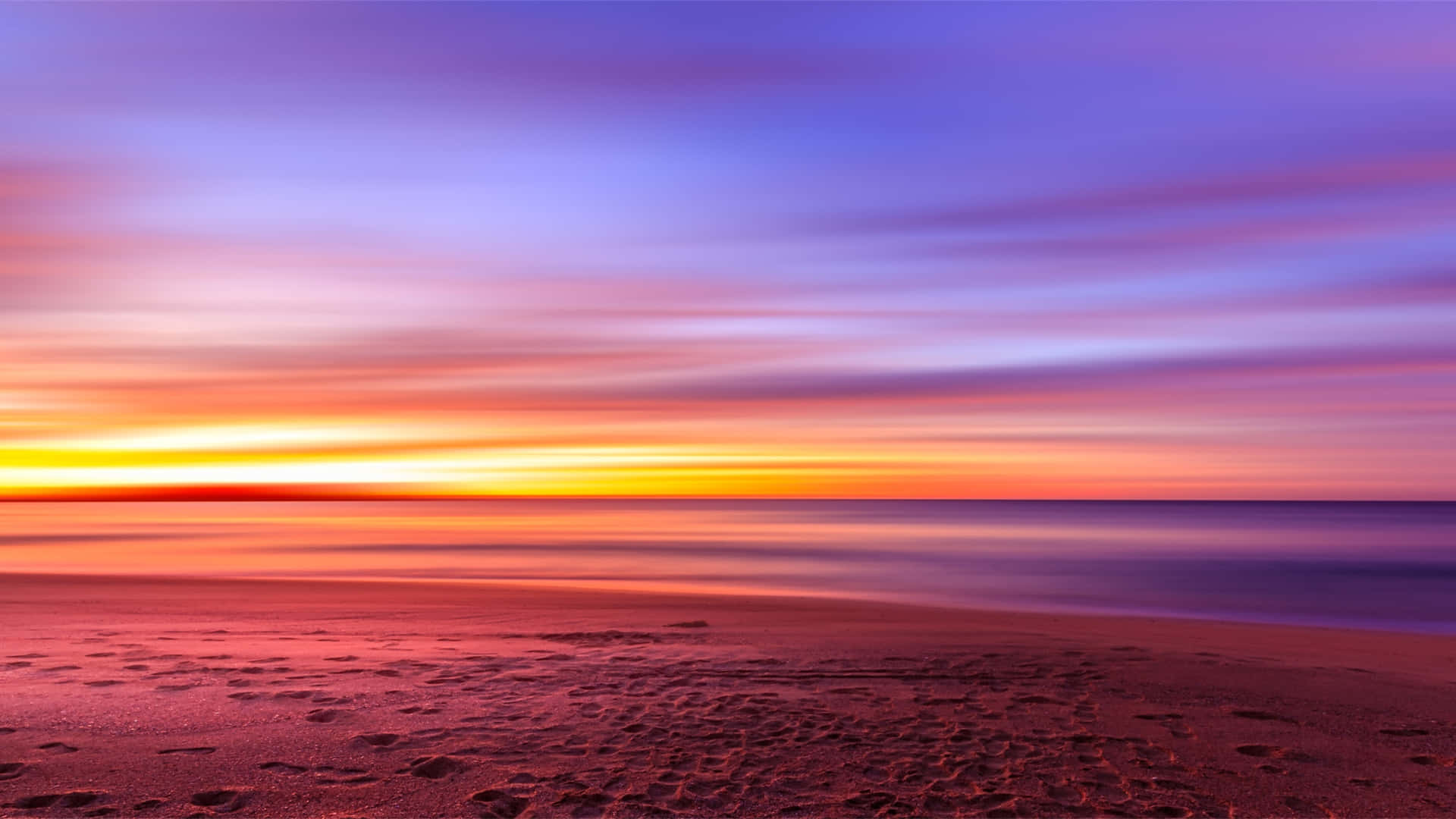 A Serene Beachscape at Sunset Wallpaper