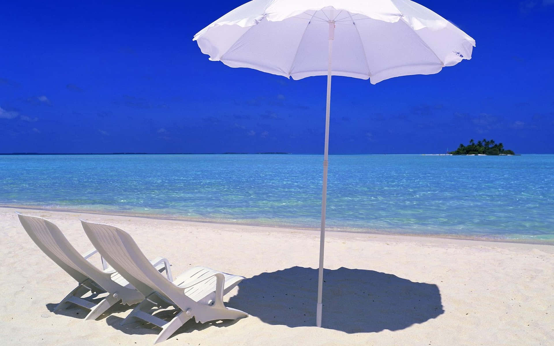 Relaxing Sunbed on the Tropical Beach Wallpaper
