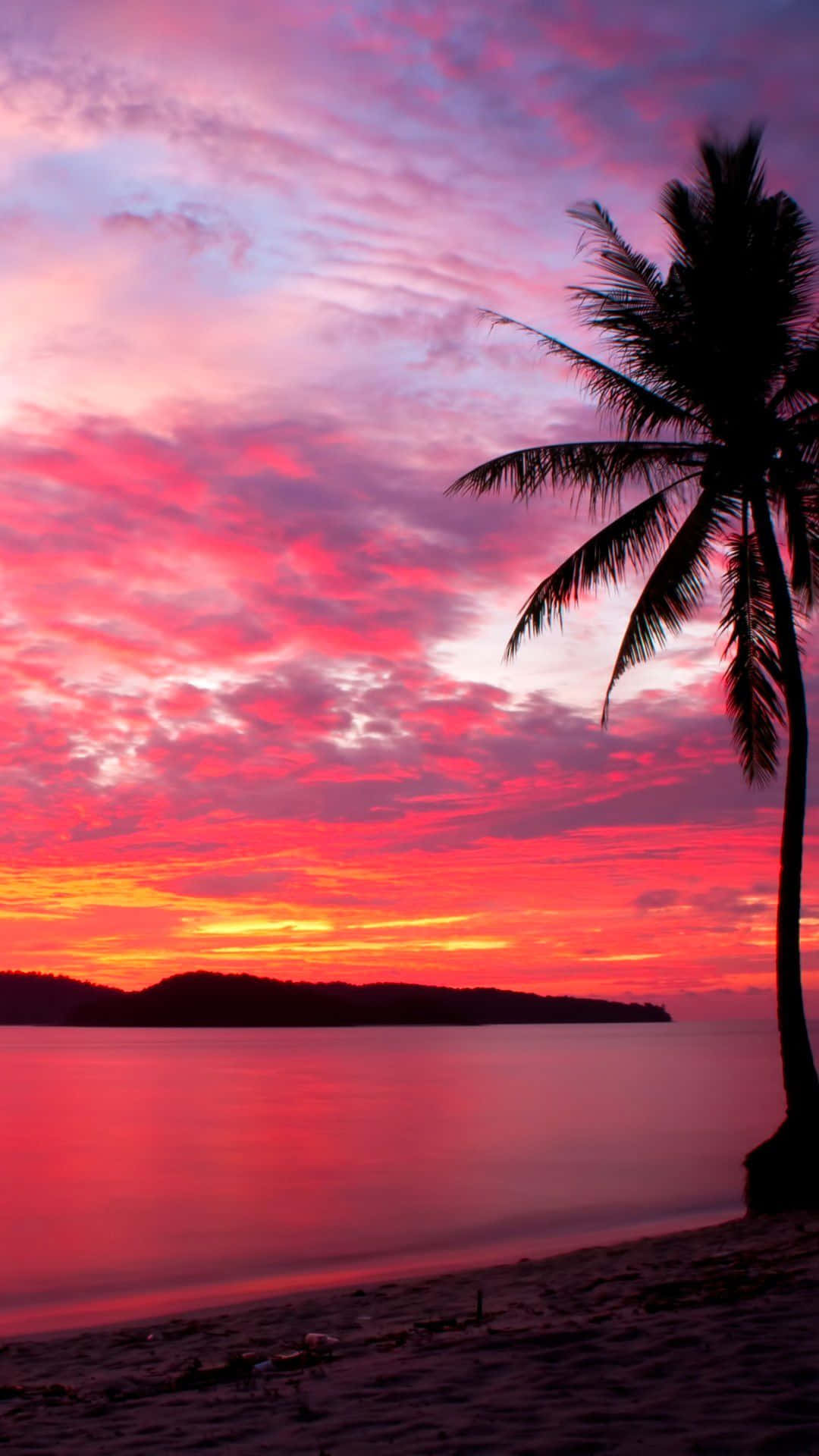 Experience the beauty of a tranquil beach sunset.