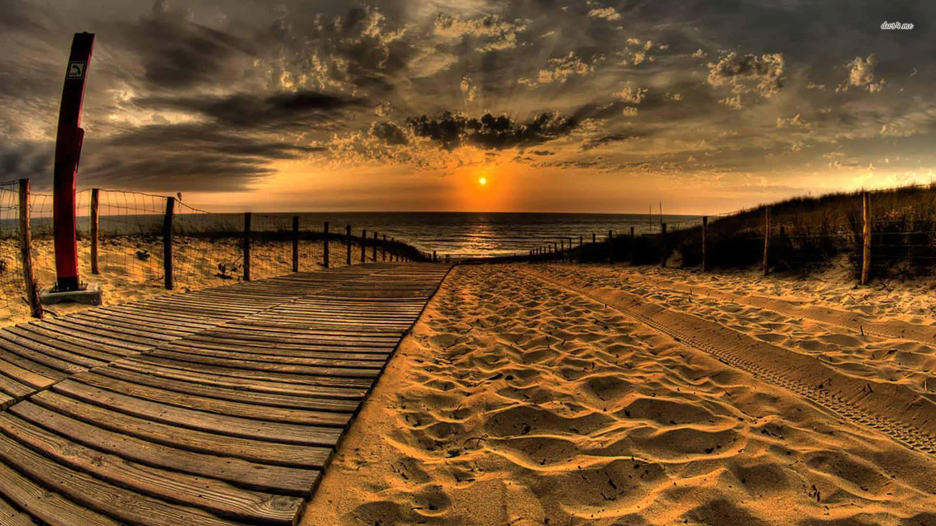 Einatemberaubender Blick Auf Einen Sonnenuntergang Am Strand Wallpaper