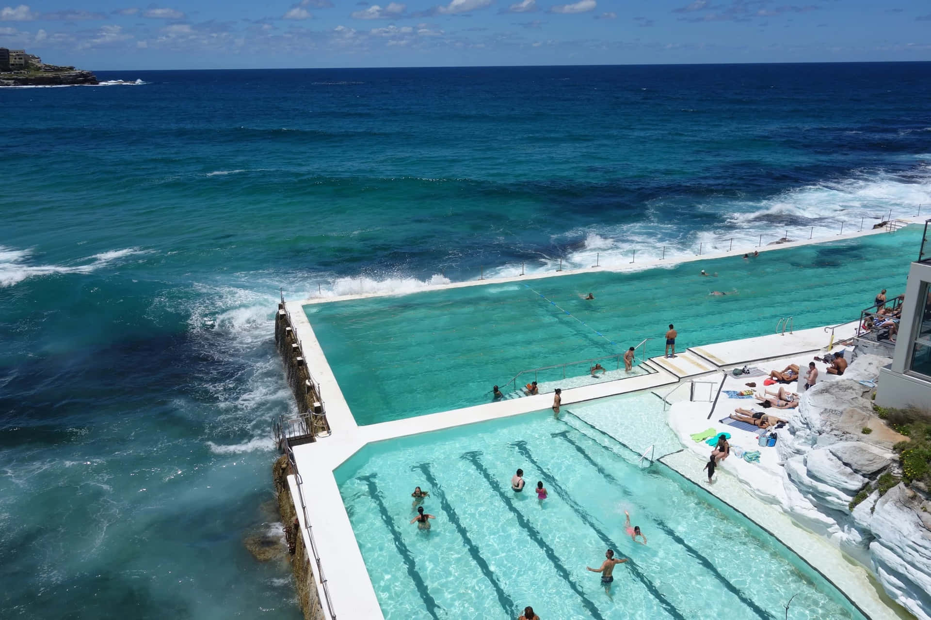 Idyllic Beach Swimming Pool overlooking the ocean Wallpaper