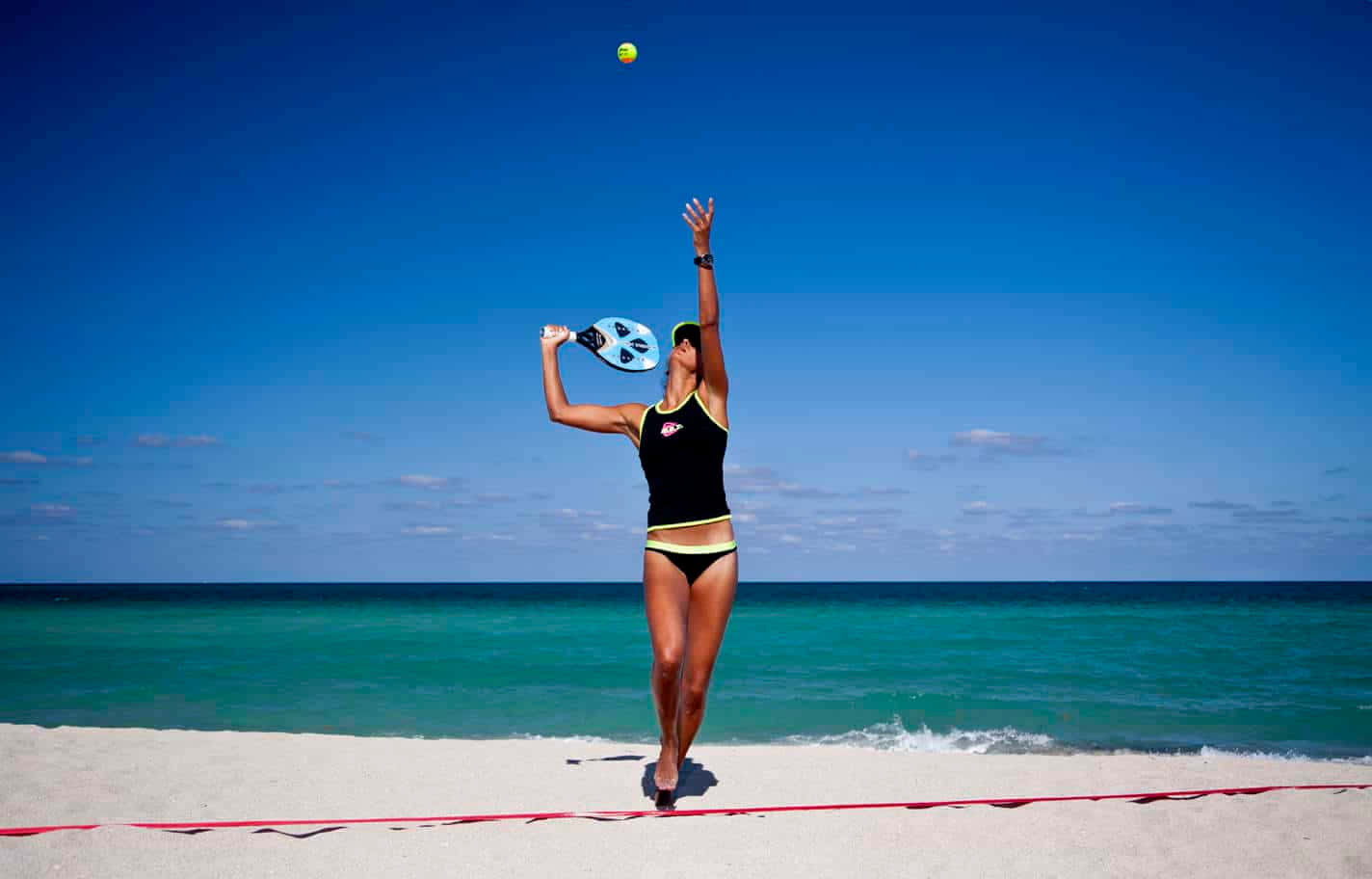Exciting game of Beach Tennis in action Wallpaper