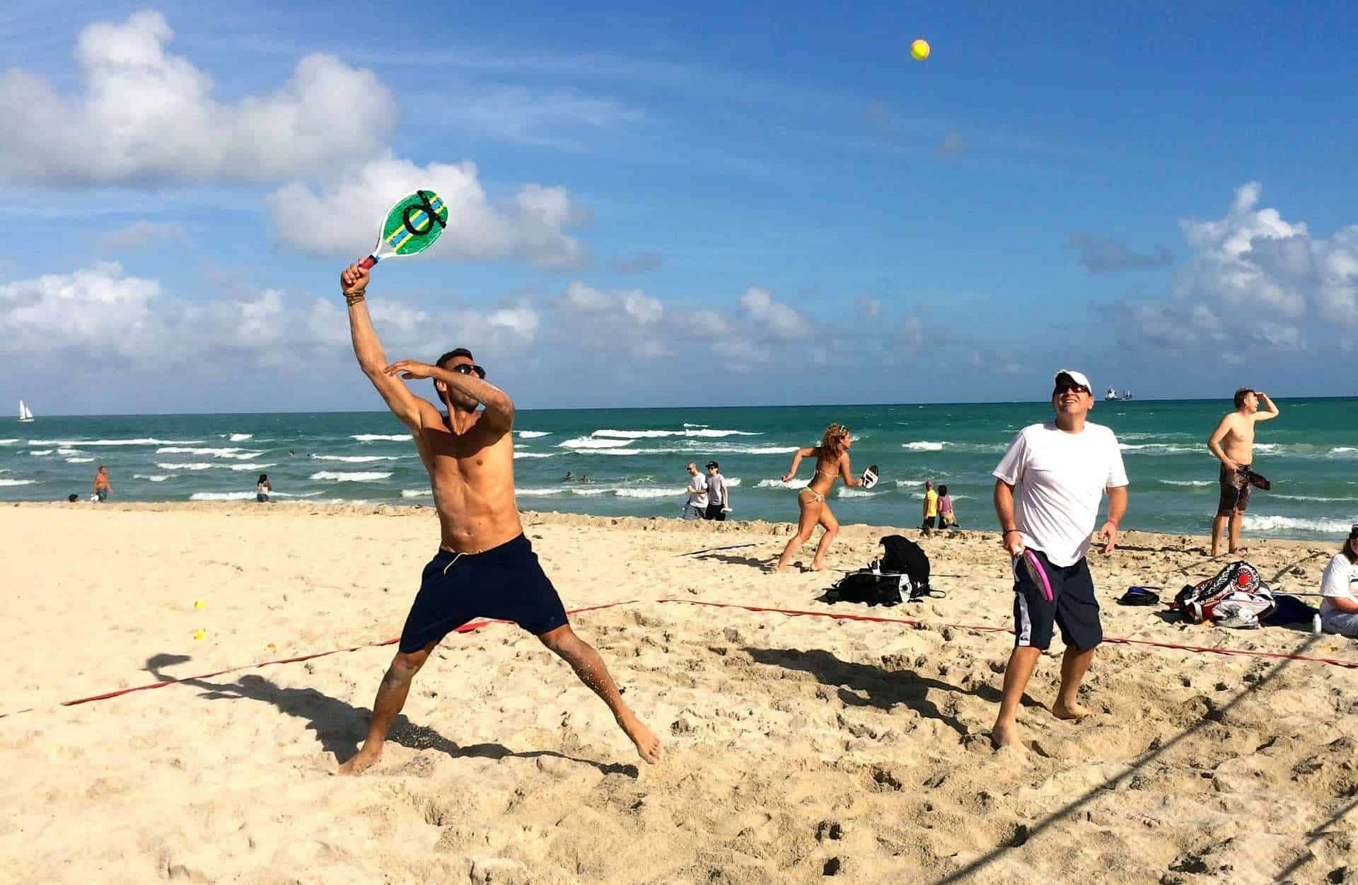 Paddle Partners Playing Beach Tennis Wallpaper