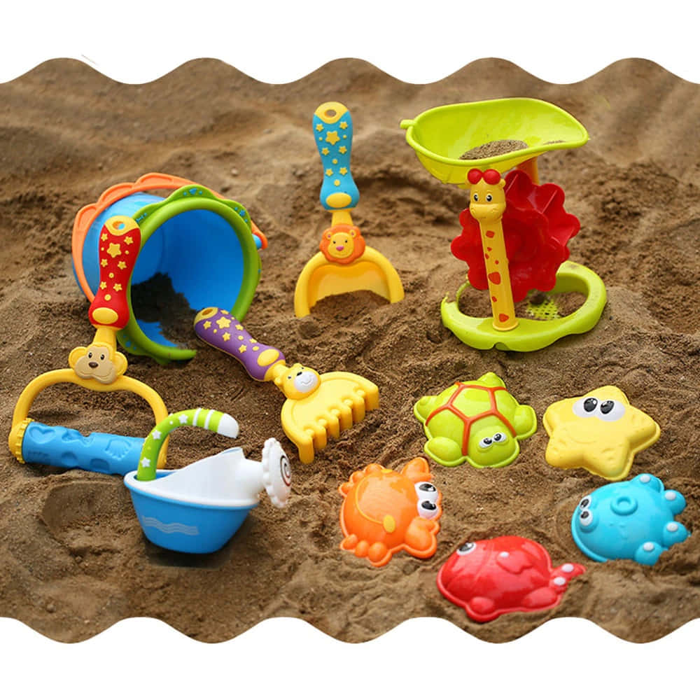 Colorful Beach Toys in the Sand Wallpaper