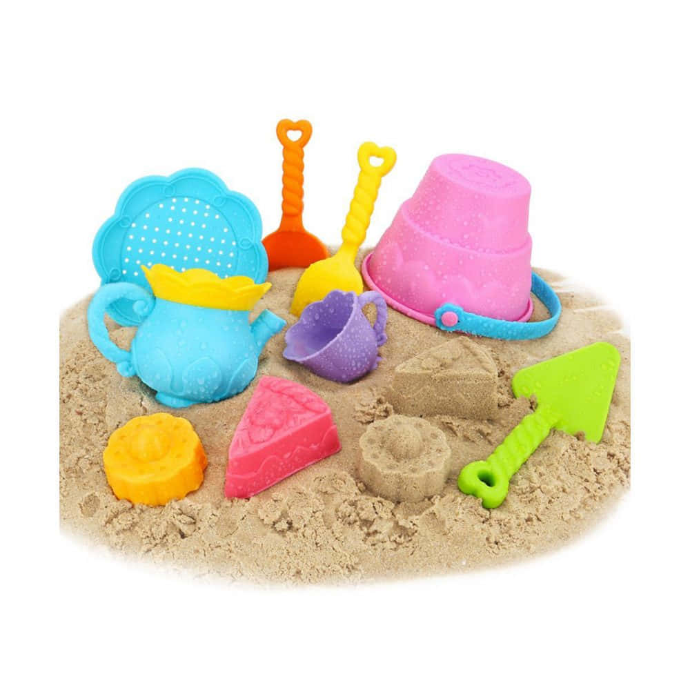 Colorful Beach Toys on Sandy Shore Wallpaper