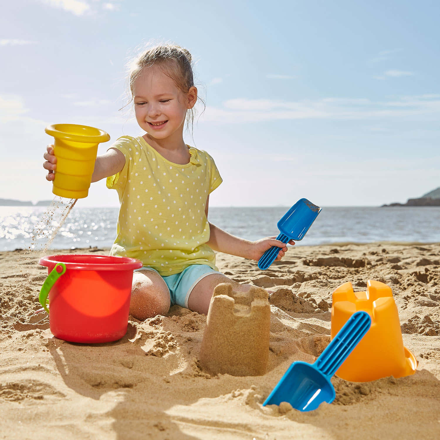 Colorful Beach Toys on the Sand Wallpaper