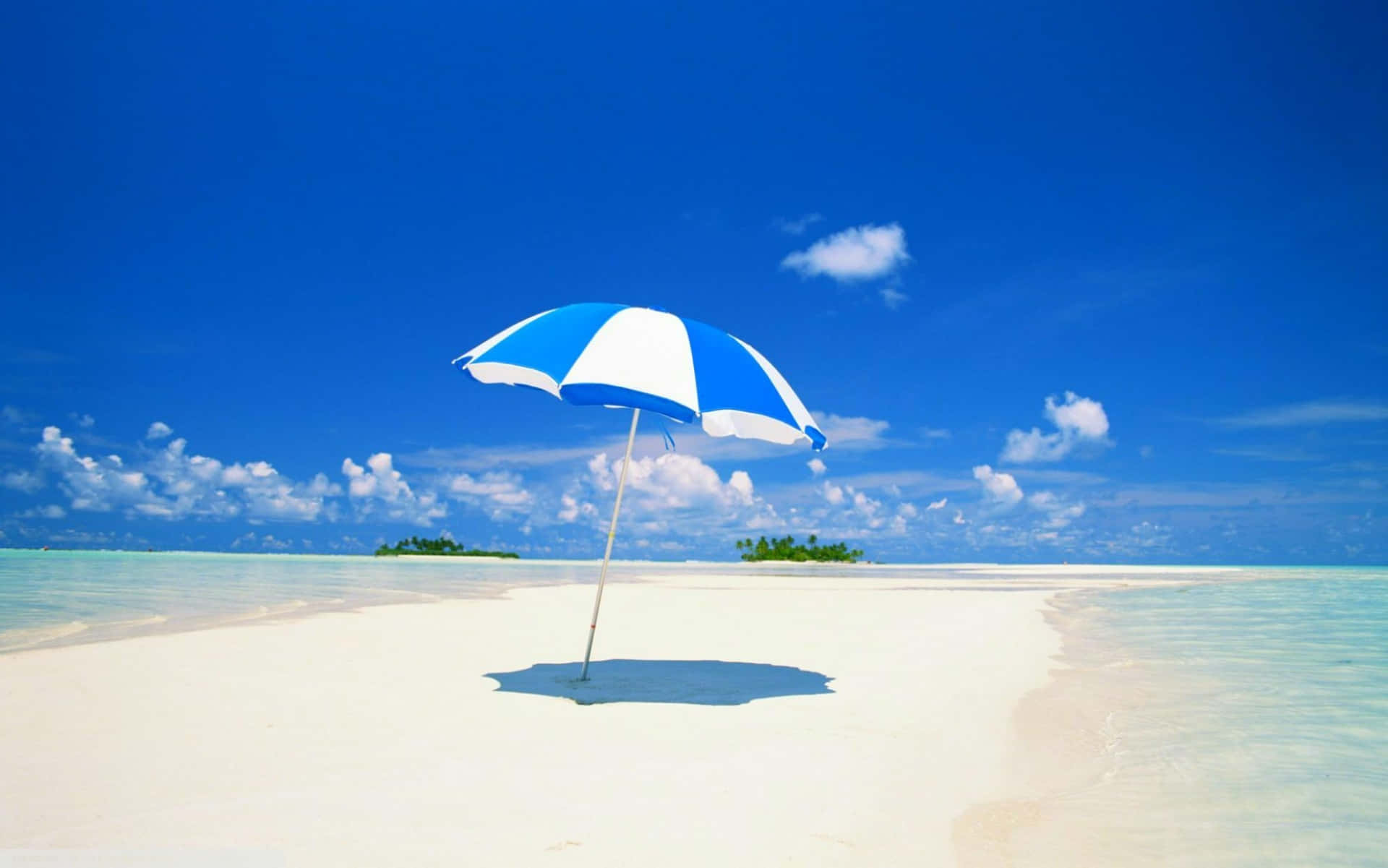 Beautiful Beach Umbrella on Sunny Day Wallpaper