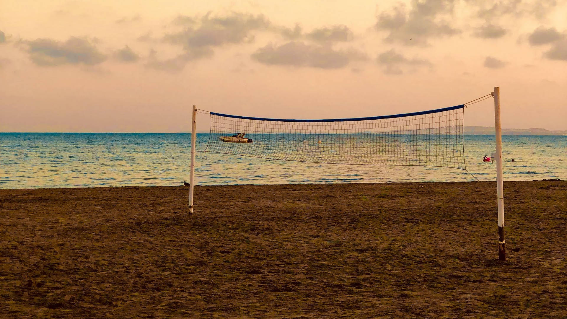 Beach Volleyball With Ocean Horizon View Wallpaper
