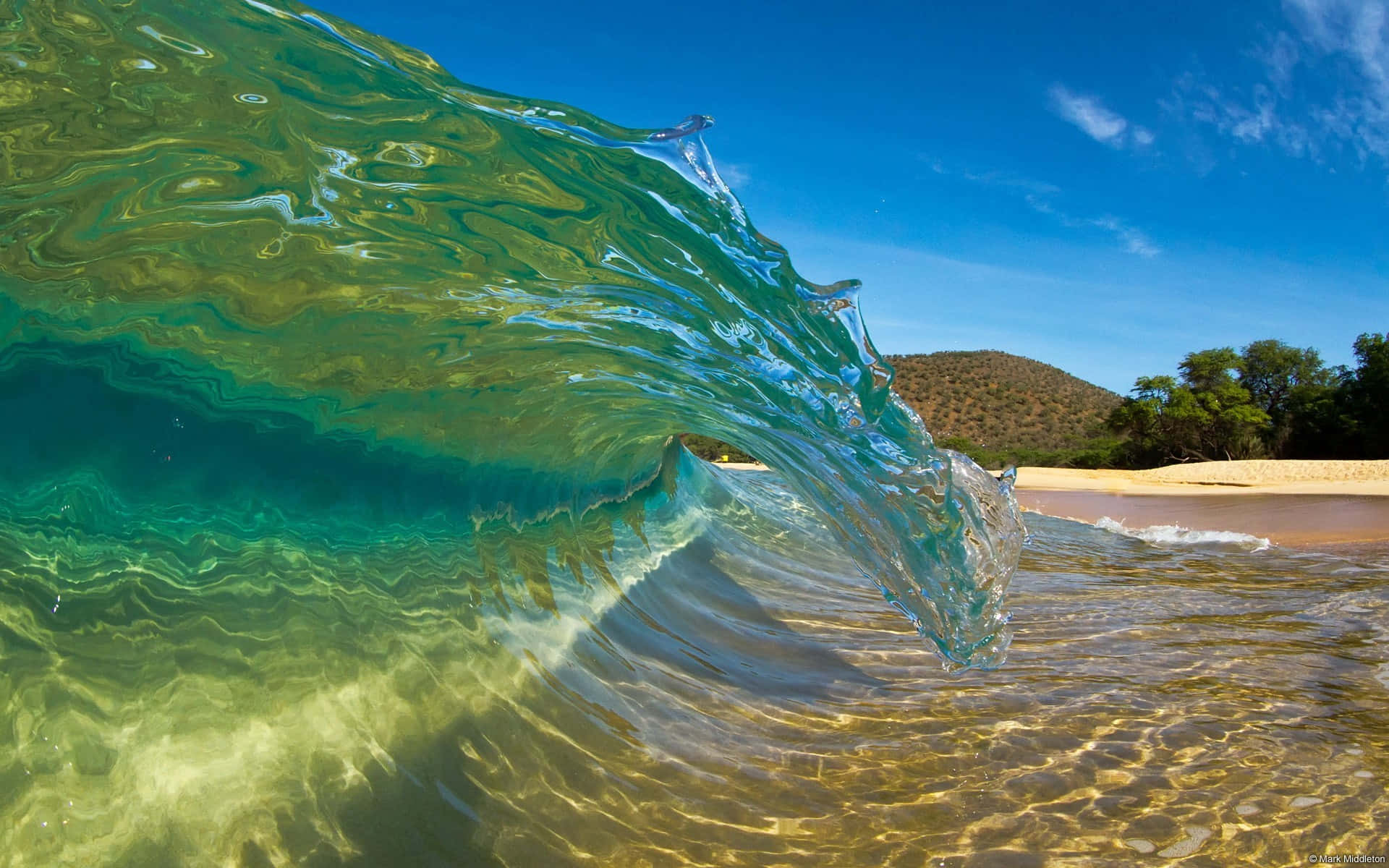 Perfect waves crashing on a sunlit beach Wallpaper