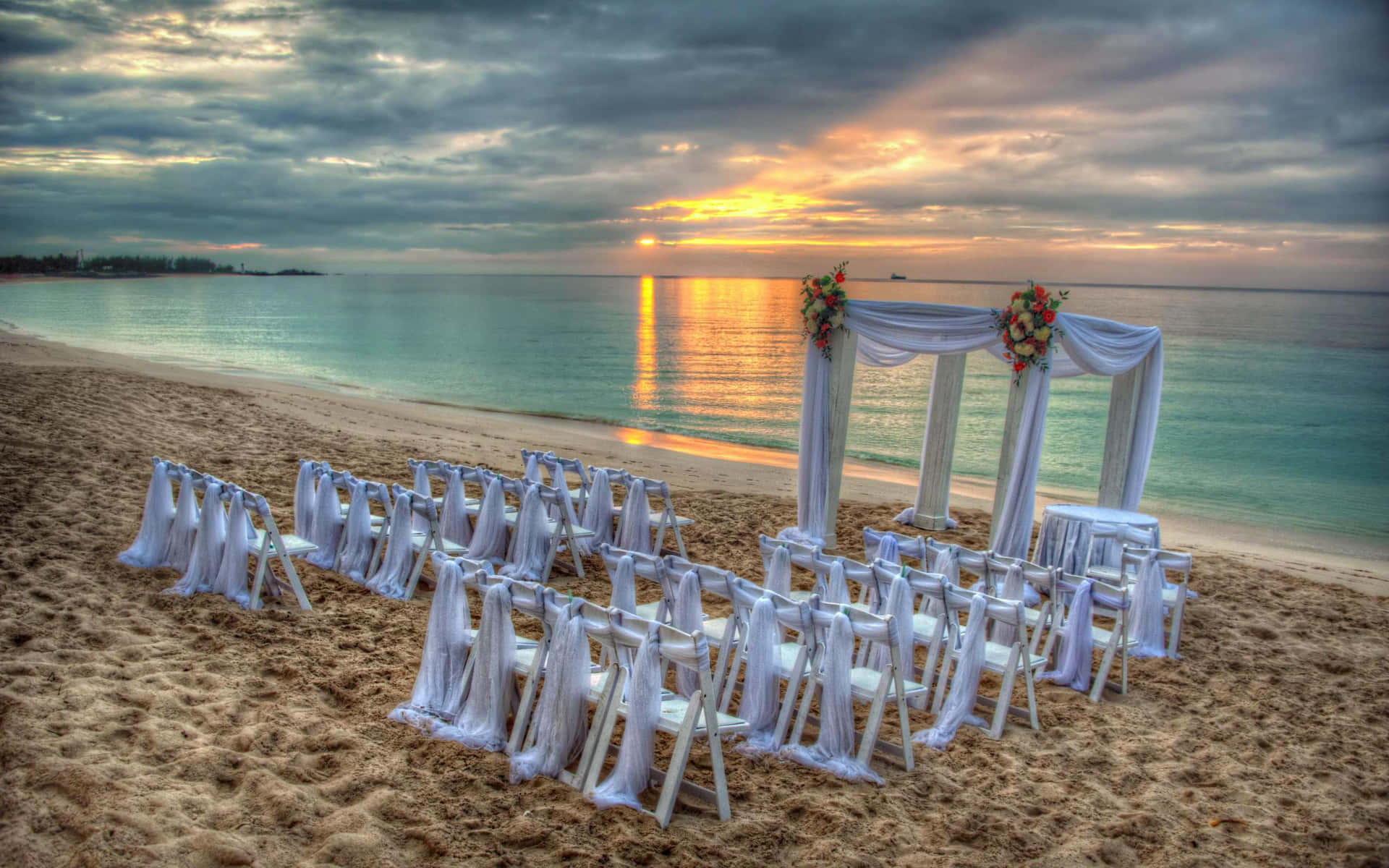A beautiful beach wedding ceremony at sunset