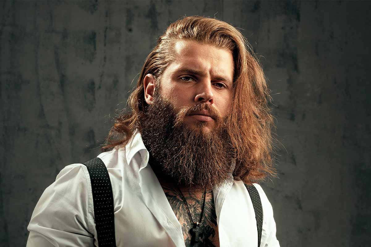 A Man With A Long Beard And Suspenders