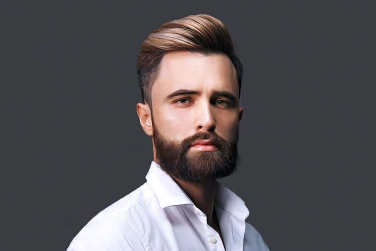 A Man With A Beard And A White Shirt