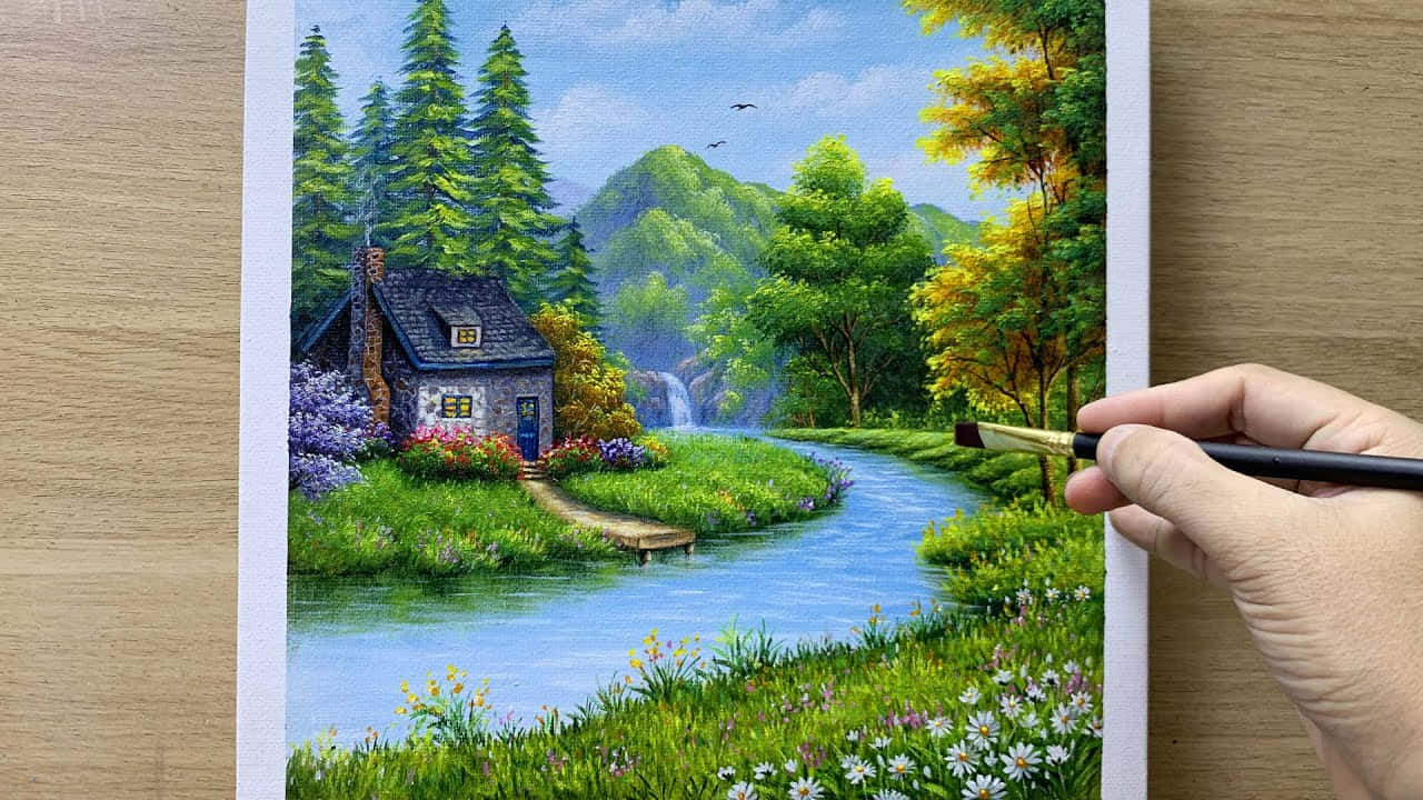 Eineperson, Die Ein Gemälde Von Einem Haus Im Wald Malt.