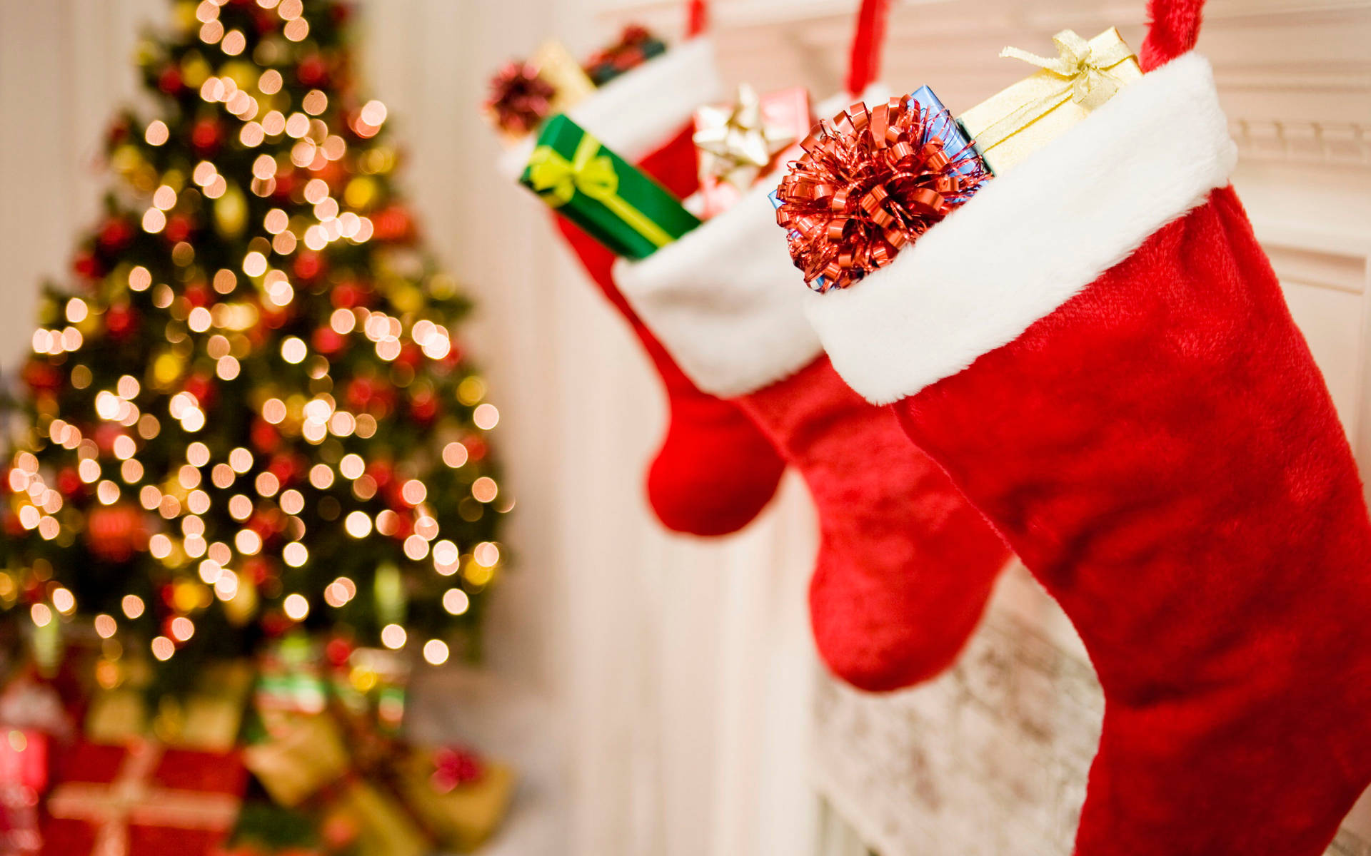 Beautiful Christmas Stockings With Gifts Wallpaper