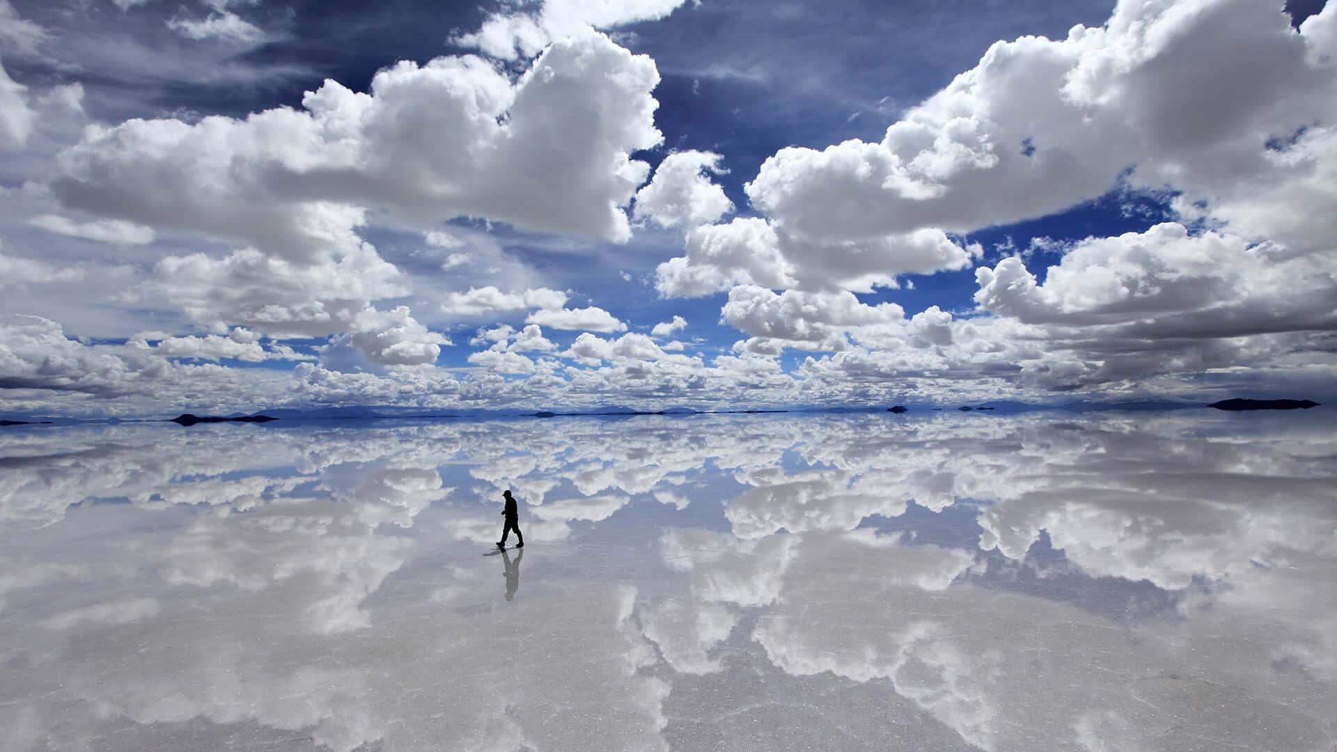 "A beautiful view of bright, white clouds in a majestic blue sky" Wallpaper