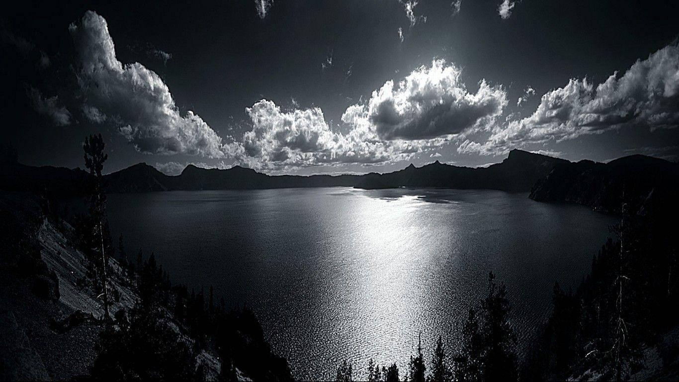 Beautiful Dark Grayscale Lake With Mountains Wallpaper
