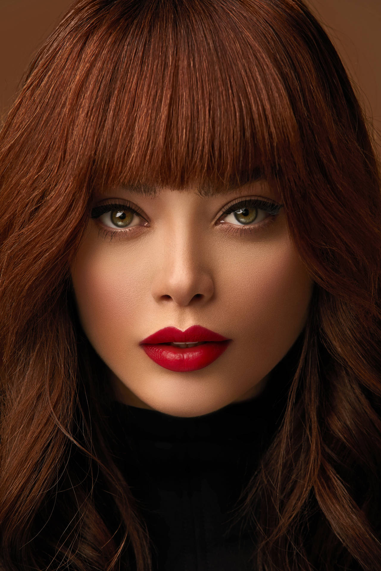 Caption: Striking Beauty: Red-haired Woman with a Stunning Face Wallpaper