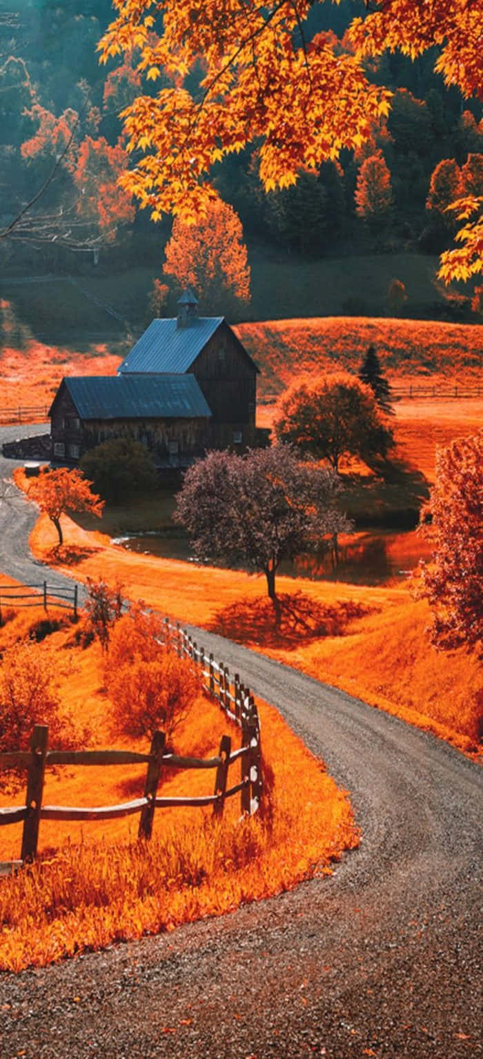 Autumn In The Countryside With A Farm And A Fence Wallpaper