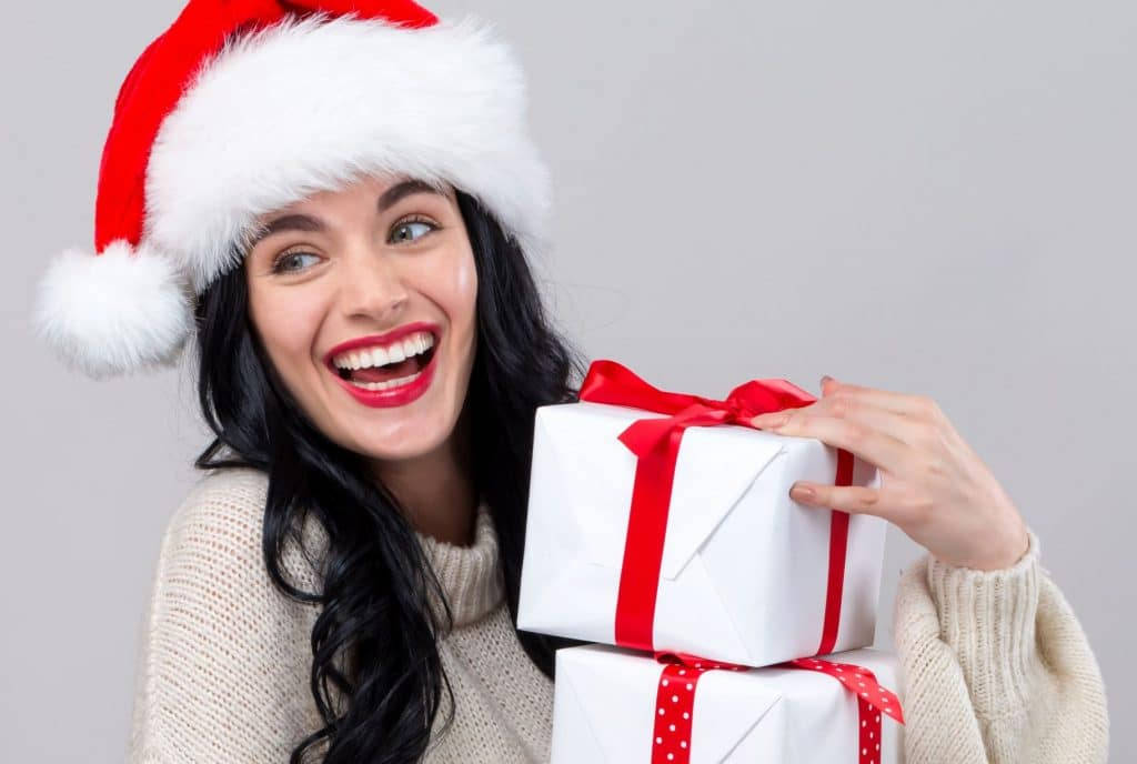 Beautiful Girl Holding Christmas Presents
