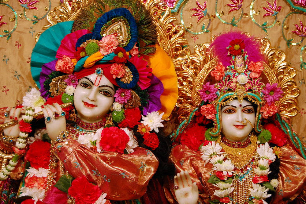 Smukke Krishna og Radha dekorerede statuer tapet Wallpaper