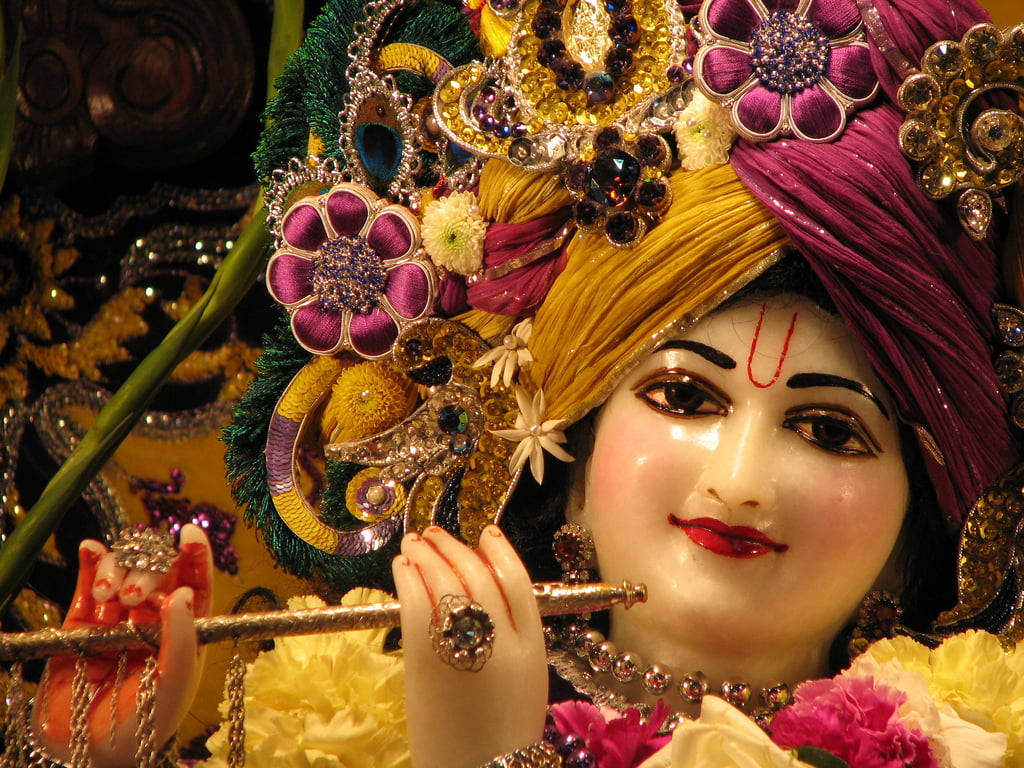 Download Beautiful Krishna Statue Smile Wallpaper | Wallpapers.com