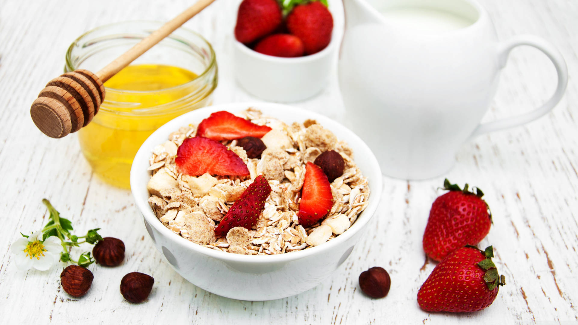 Beautiful Oatmeal Bowl With Honey, Milk, And Strawberries Wallpaper