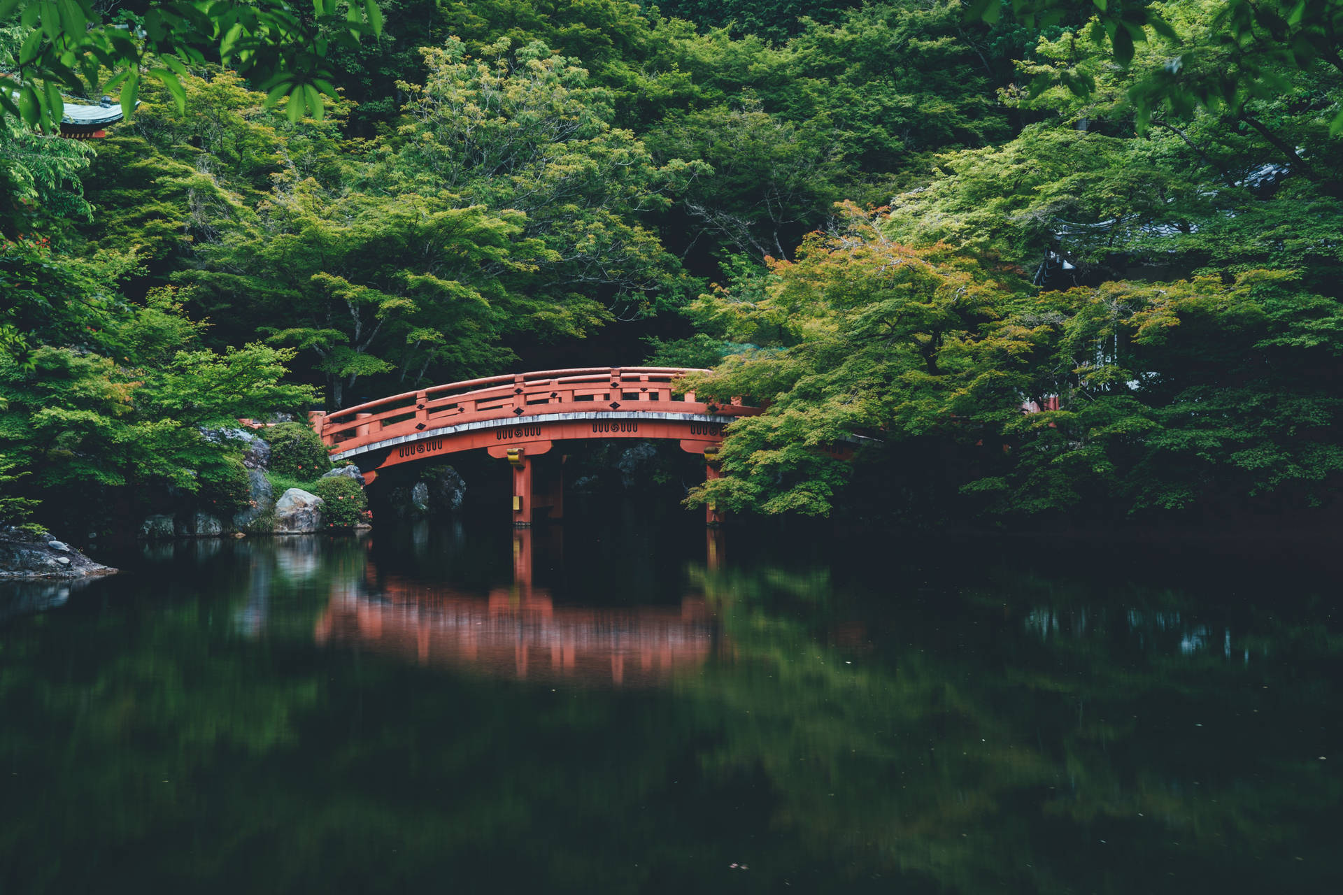 A View of the Beautiful Red Bridge in Japan Wallpaper