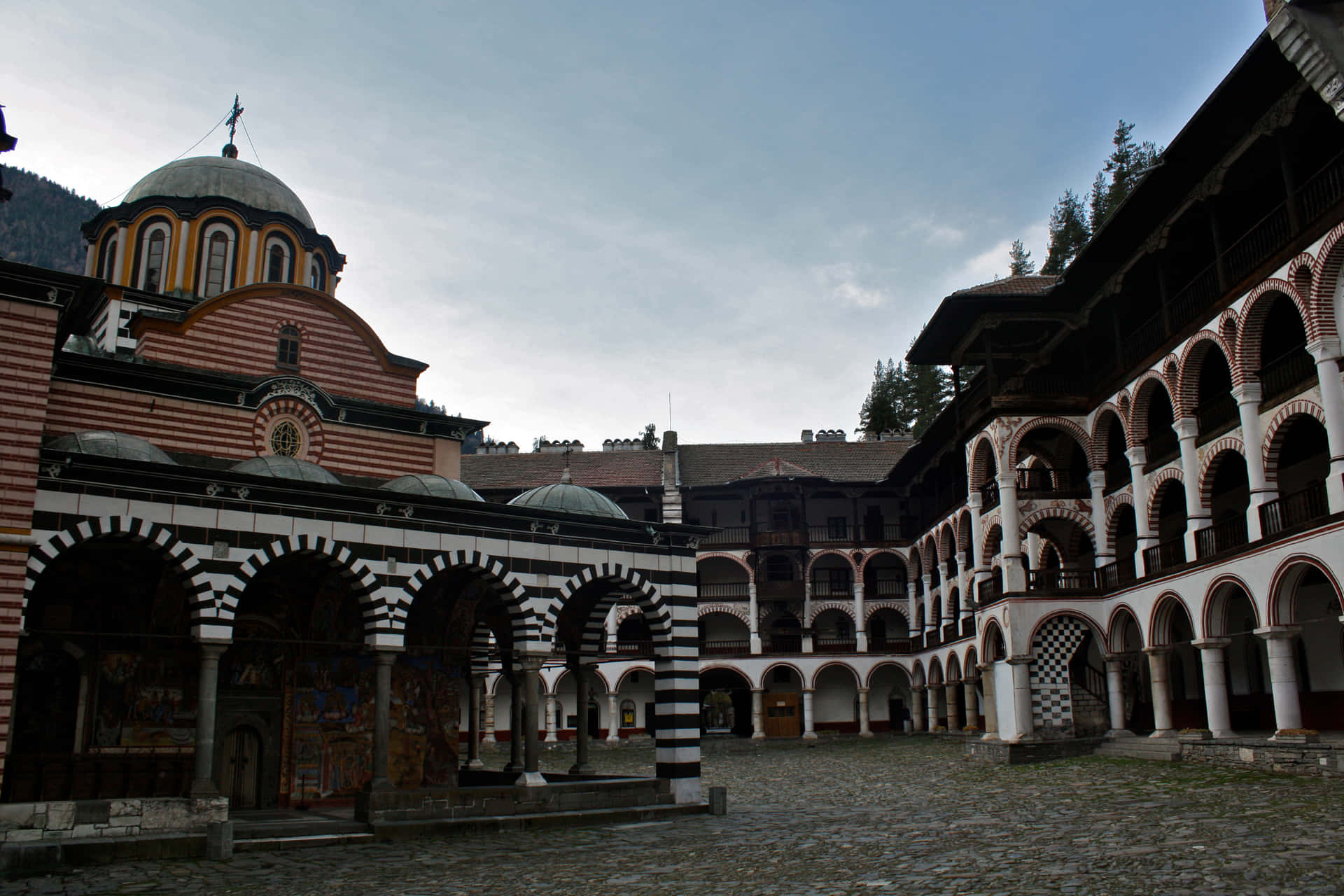 Majestic Rila Monastery against the backdrop of beautiful mountain landscapes Wallpaper