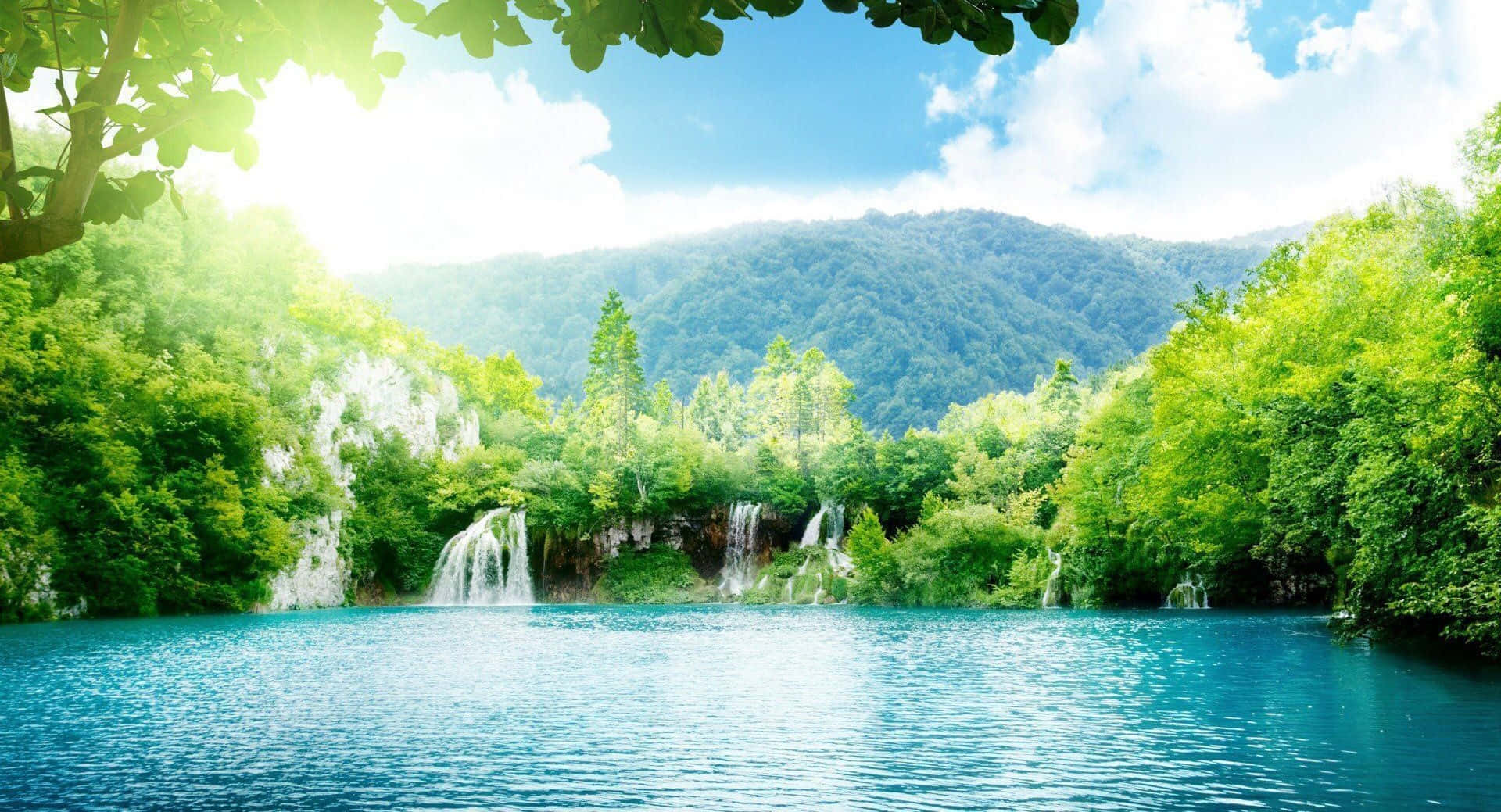 Beautiful Sunny Lake And Waterfalls Wallpaper