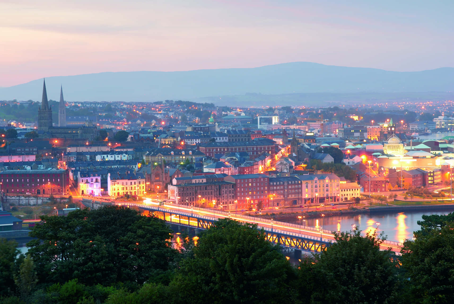 Beautiful Sunrise Over The Historic Londonderry Cityscape Wallpaper