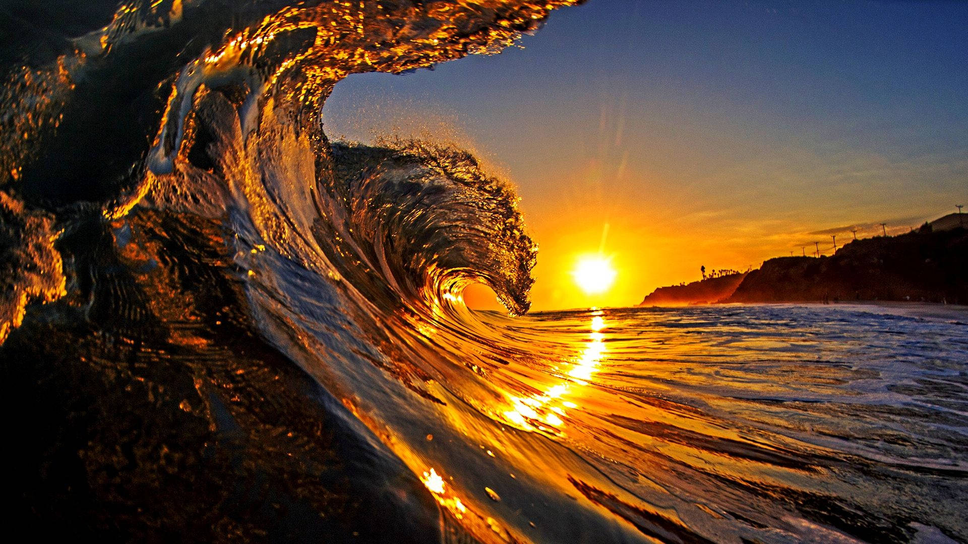 Download Beautiful Sunset And Waves Wallpaper 