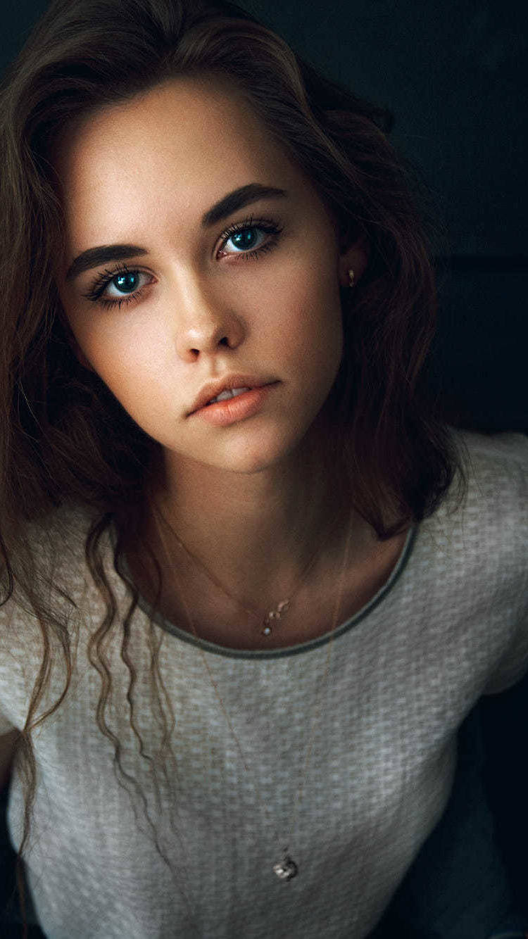 Casually Elegant - A Beautiful Teenage Girl in a Grey Top Wallpaper