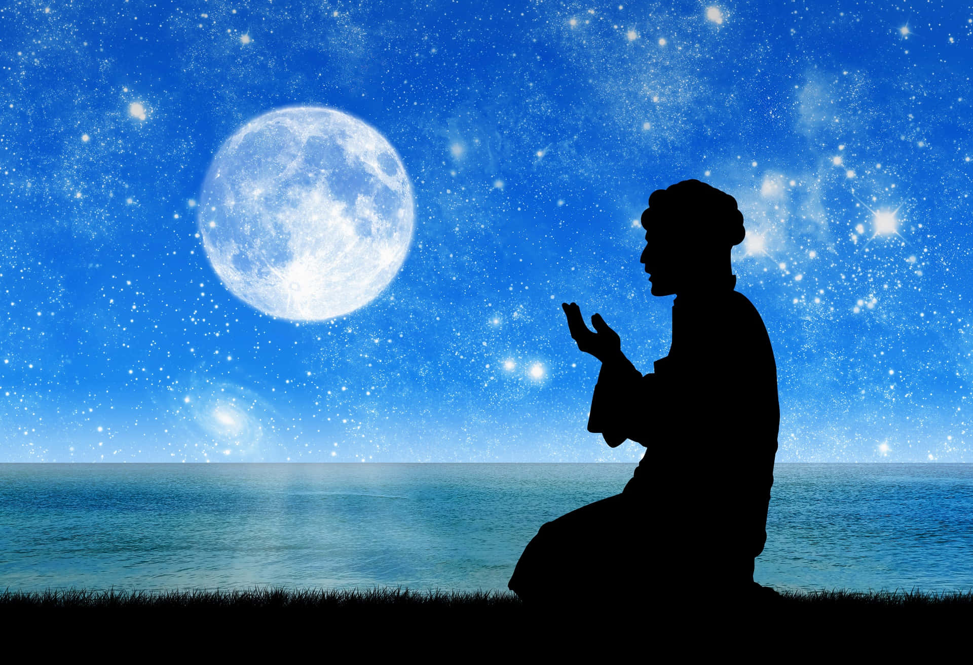 En mand beder foran månen om natten. Wallpaper