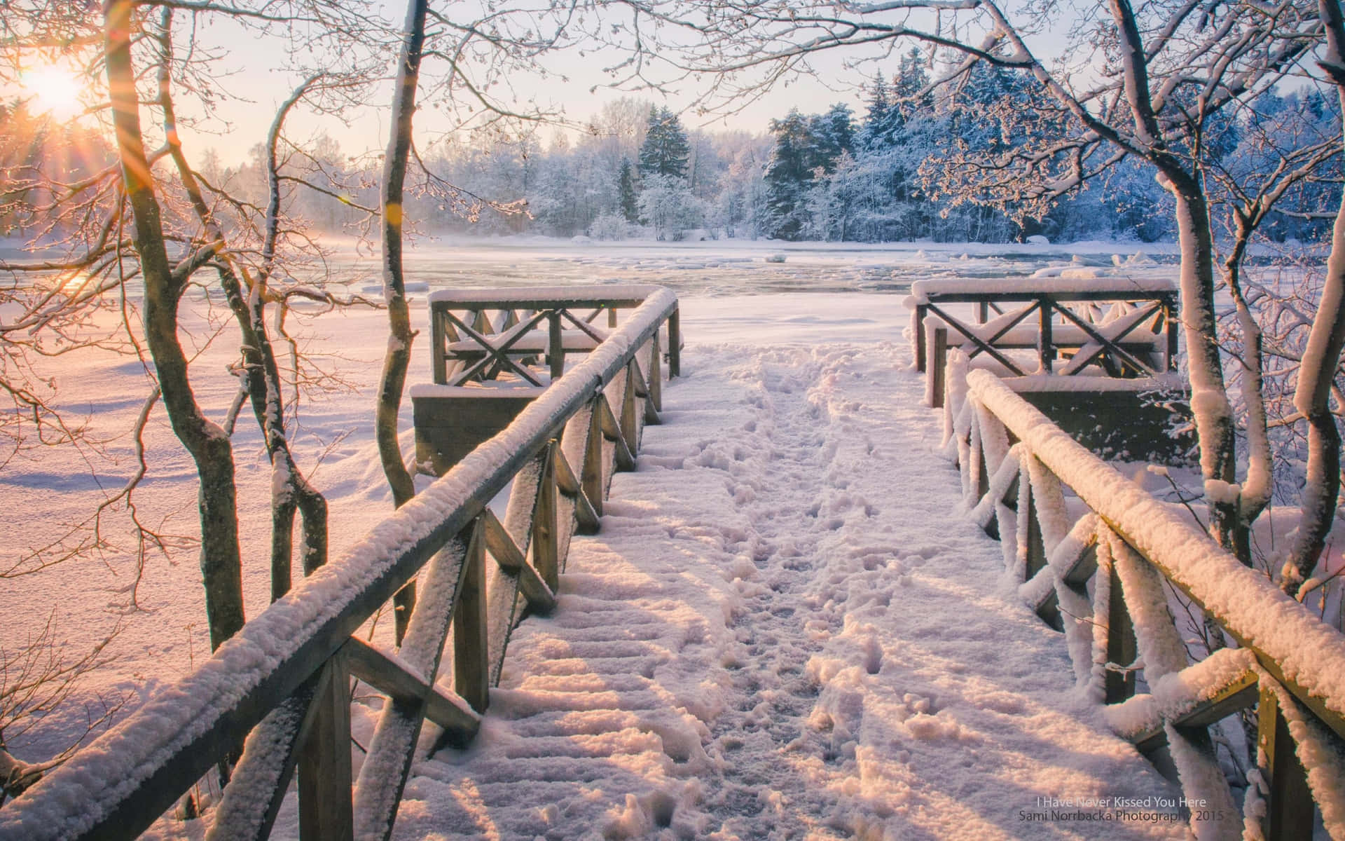 A view of a picturesque winter wonderland. Wallpaper
