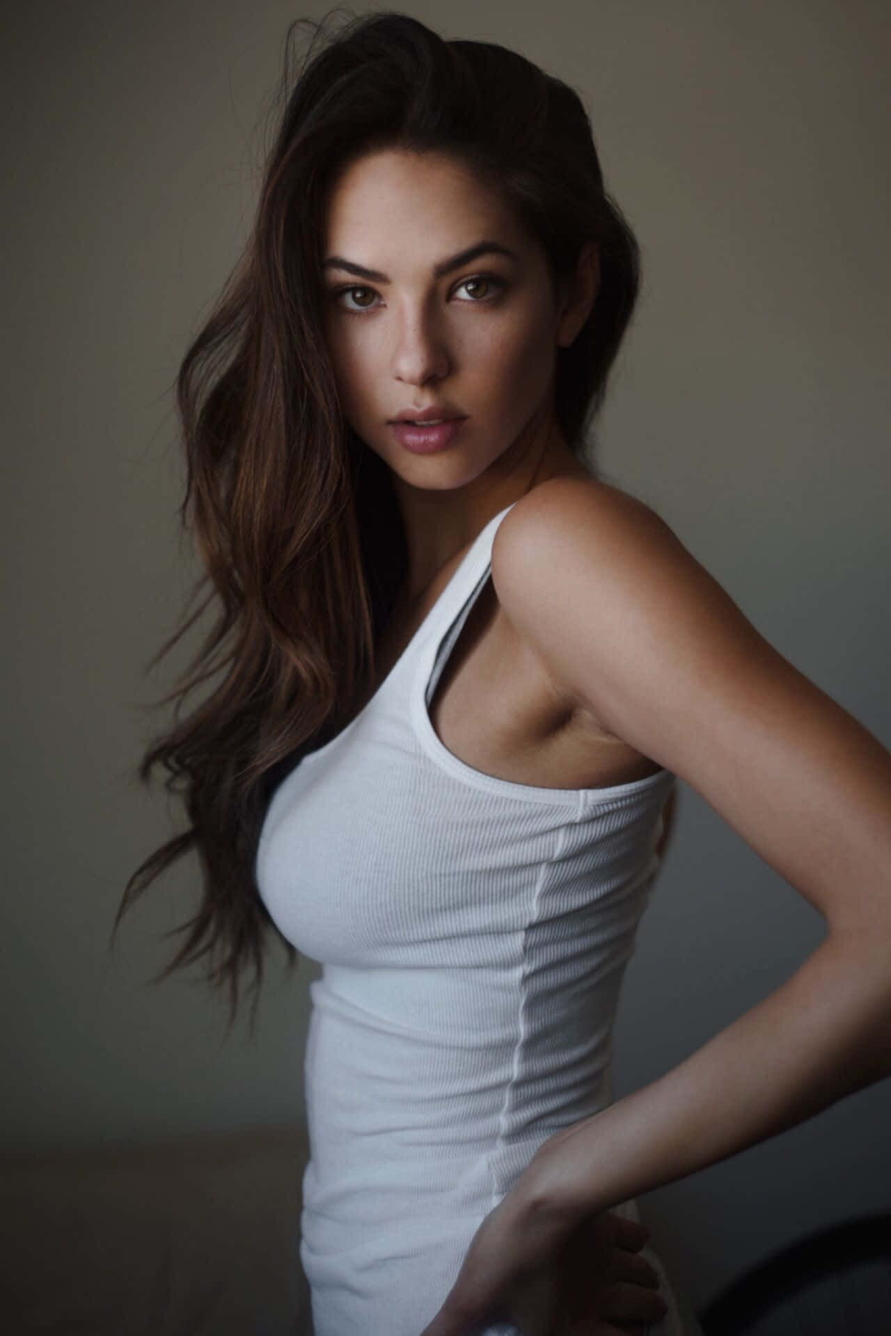 A Beautiful Woman In A White Tank Top