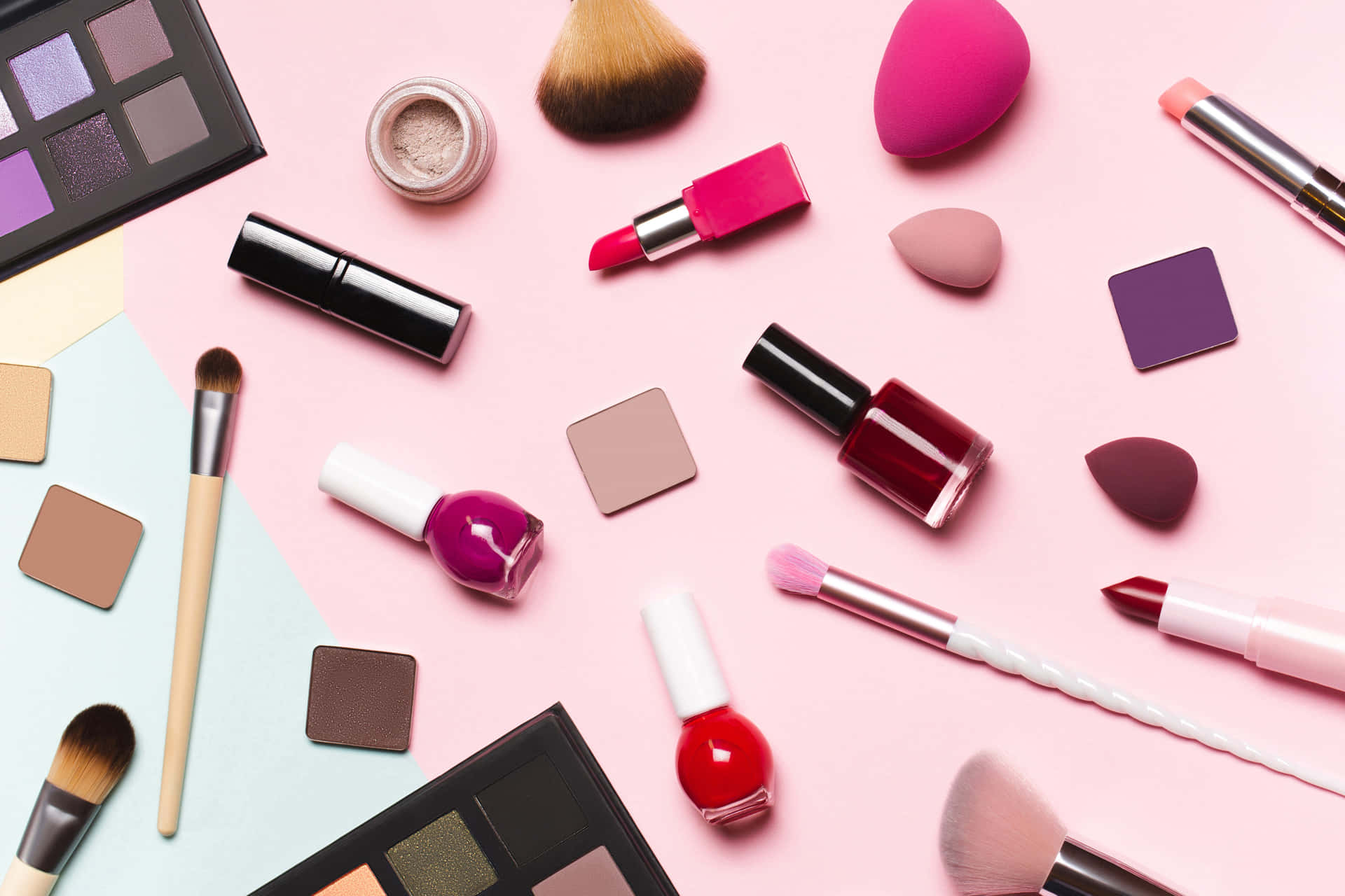 Cosmetics And Makeup Products On A Pink Background