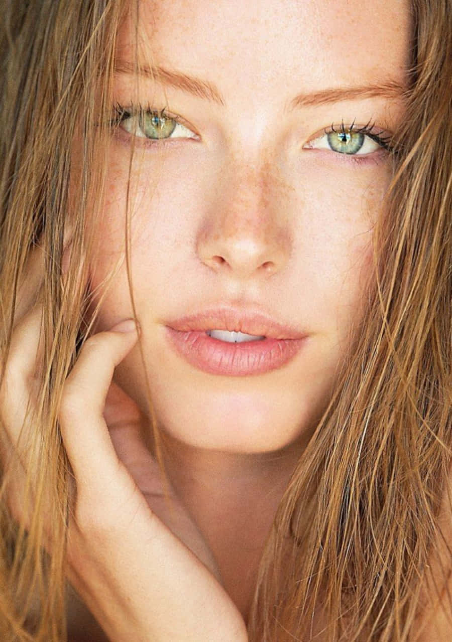 A Woman With Freckles And Green Eyes