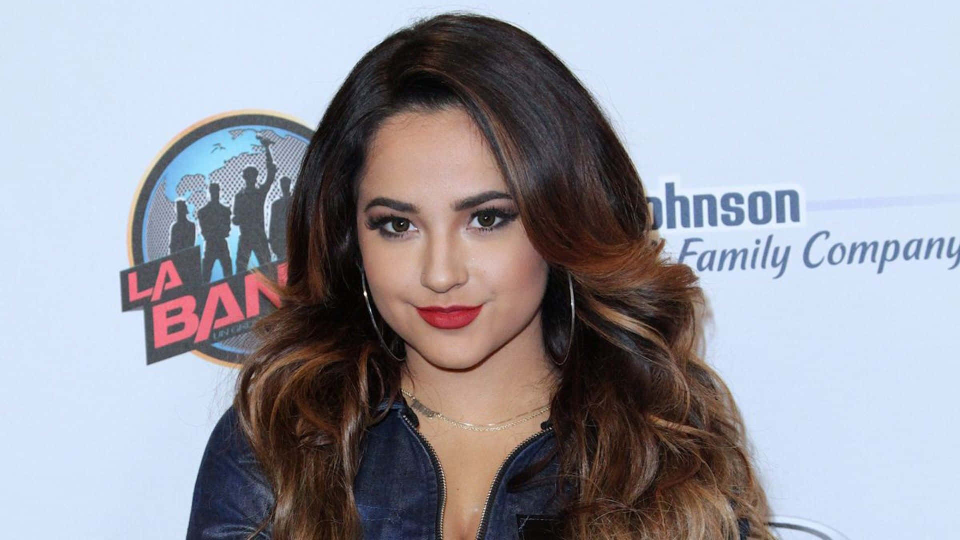 Singer and actress Becky G posing for the camera.