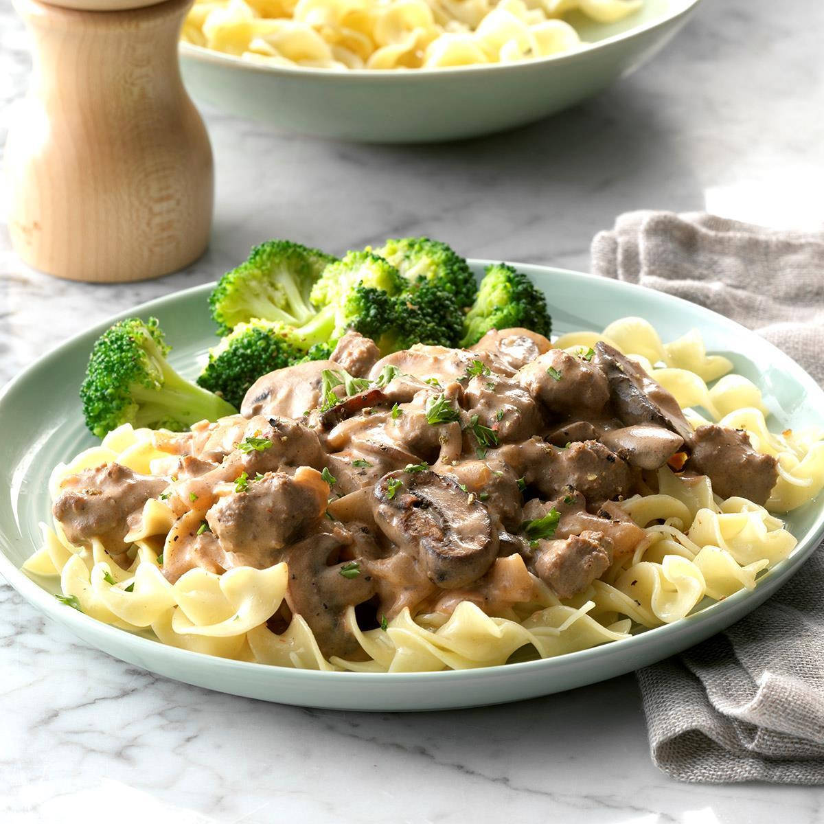 Delicious Beef Stroganoff Served Over Pasta With a Side of Broccoli Wallpaper