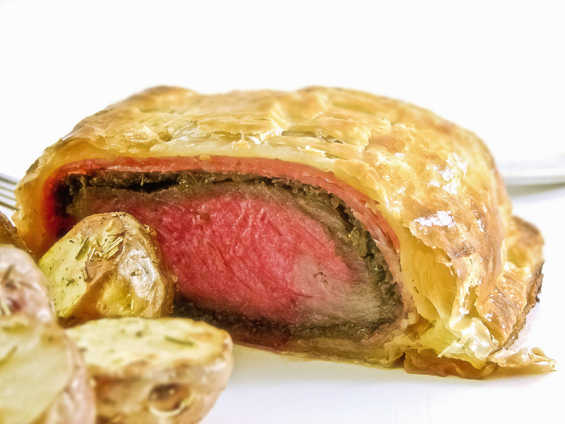 Scrumptious Beef Wellington with a side of Garlic Bread Wallpaper