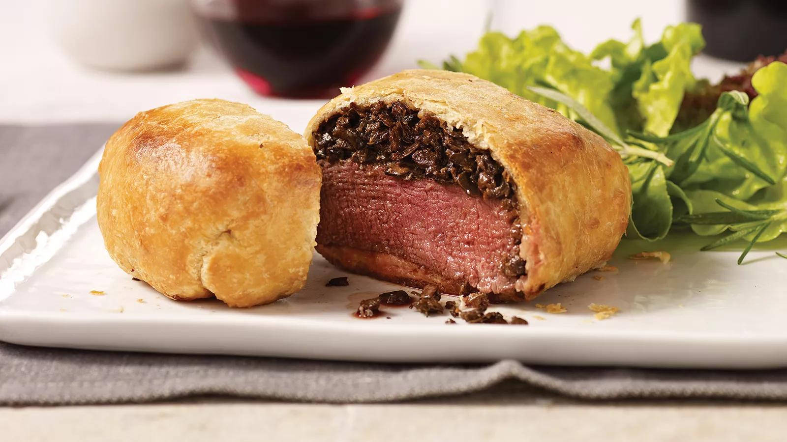 Exquisite Beef Wellington with Leafy Green Garnish Wallpaper