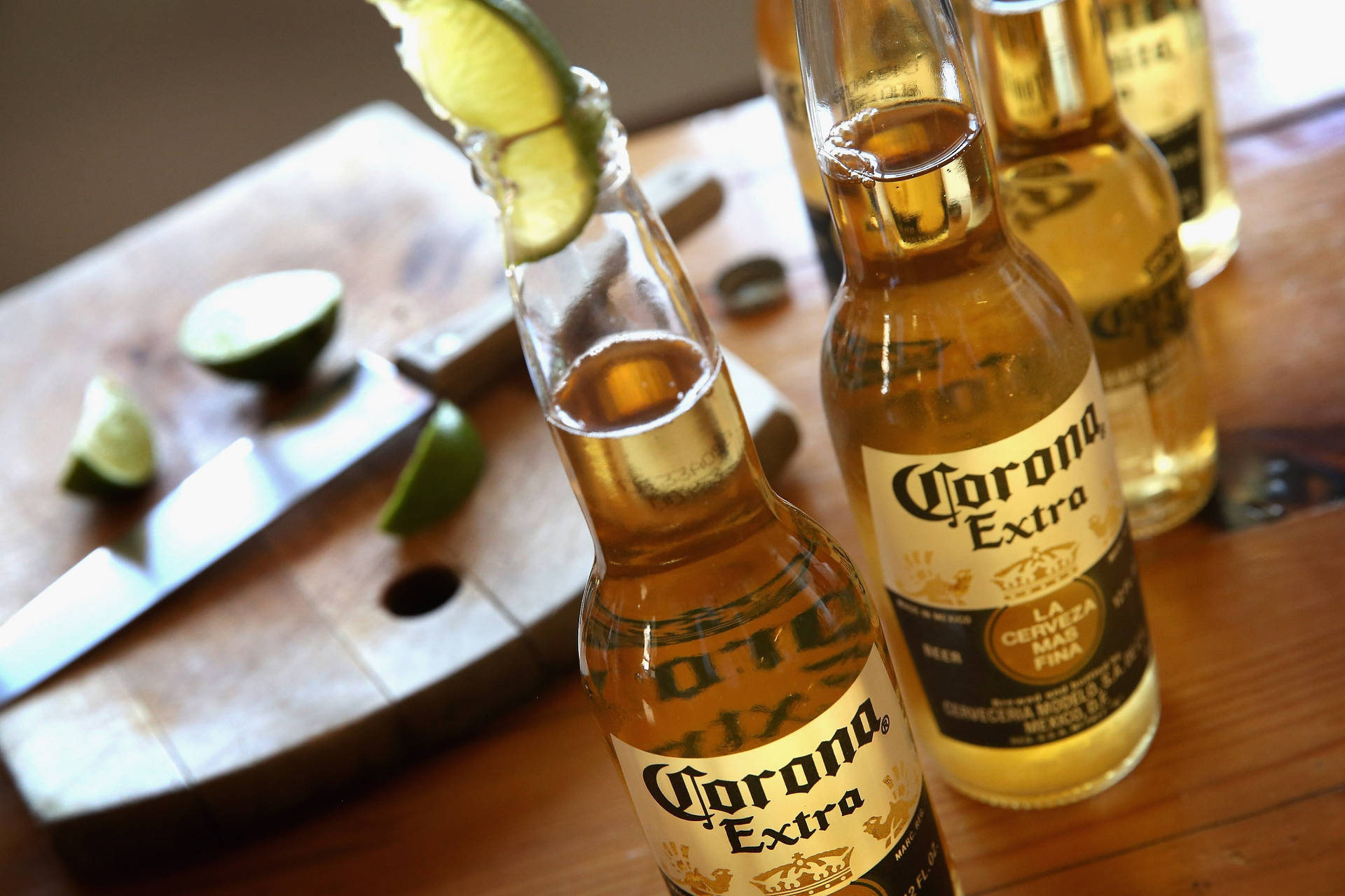 Caption: A Refreshing Corona Beer Bottle Wallpaper