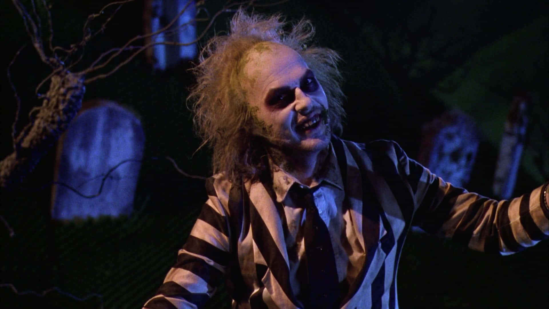 Beetlejuice posing with his iconic twisted grin