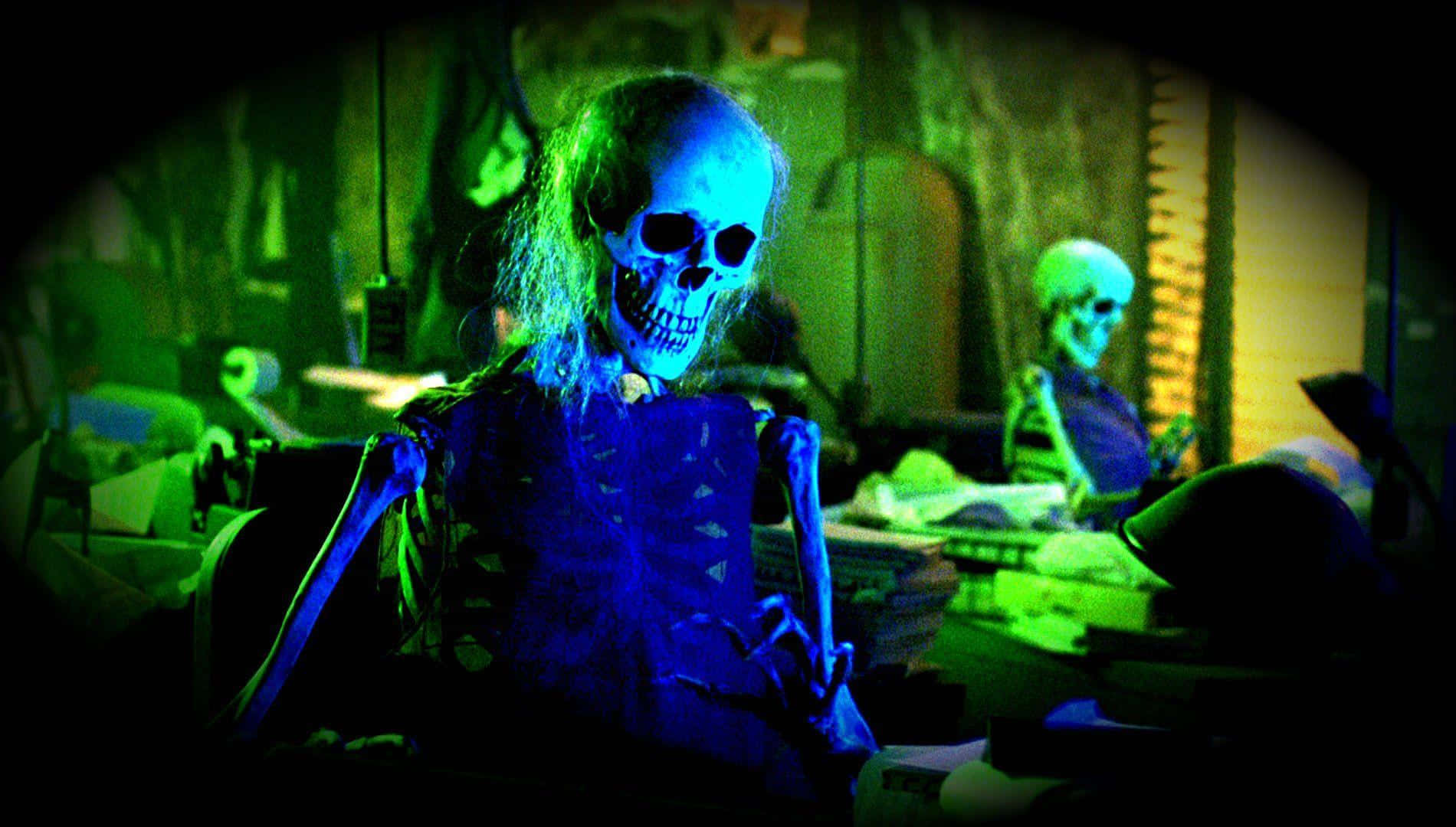 A Skeleton Sitting In A Dark Room